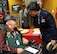 Maj. Gen. Peggy Poore, Air Force Personnel Center commander, spends time talking to Andrew Roca, Veterans Administration Voluntary Service volunteer, during the 2014 National Salute to Veteran Patients Program Feb. 14 at San Antonio's Audie L. Murphy VA Hospital. The military ambassadors and Joint Base San Antonio military 
leaders were on hand to distribute valentines and visit with veteran patients. Veterans administration facilities across the United States pay tribute to veteran patients annually during this week-long salute. 
(U.S. Air Force photo by Melissa Peterson)
