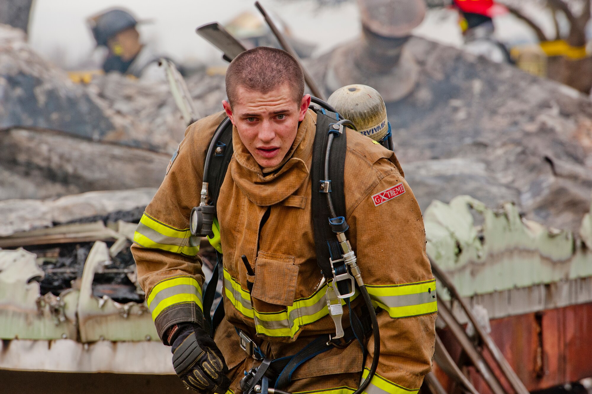 A Vacaville Fire Protection District firefighter walks away from a burned trailer Feb. 18 in Vacaville, Calif. Travis fire department arrived at the same time as VFPD at approximately 3:45 p.m. (U.S. Air Force photo/Tech. Sgt. Matthew Hannen)