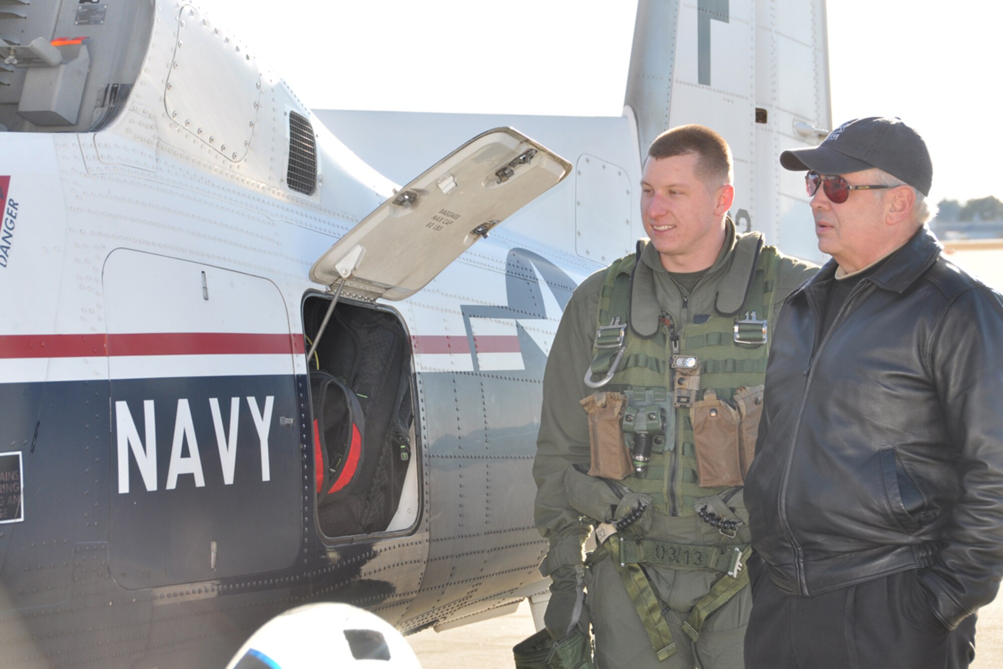 Marine 1st Lt. Eric Schwinghammer, pilot, gives Richard Rector, Jr. ROTC event facilitator. , a tour of a T-6B Texan II aircraft upon landing at Dobbins Air Reserve Base, Jan. 22. The T-6 Texan II is a tandem seat, turboprop trainer. Its primary mission is to train Navy and USMC pilots. Schwinghammer visited nearby Lassiter High School JROTC members to discuss opportunities in naval aviation. (U.S. Air Force photo/James Branch)