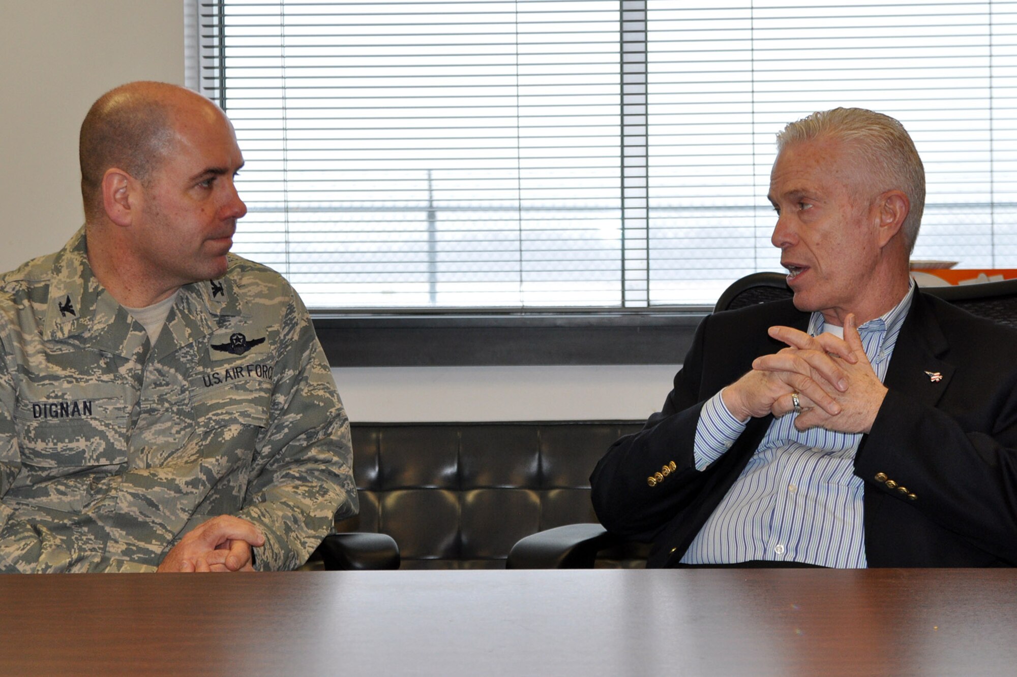 YOUNGSTOWN AIR RESERVE STATION, Ohio – Air Force Reserve Col. James Dignan, commander of the 910th Airlift Wing, talks with Congressman Bill Johnson, Ohio 6th district, during the U.S. representative’s visit to the Federal Aviation Administration’s Air Traffic Control Tower located here, Feb. 14, 2014. Johnson visited the FAA tower and adjacent Youngstown-Warren Regional Airport to discuss a variety of issues affecting the facilities and YARS. The 910th’s installation is designated as an air station because it utilizes the FAA tower and the runways maintained by the airport to accomplish the wing’s mission to ‘Deploy, Deliver, Defend’ anytime, anywhere around the globe. U.S. Air Force photo by Master Sgt. Bob Barko Jr.