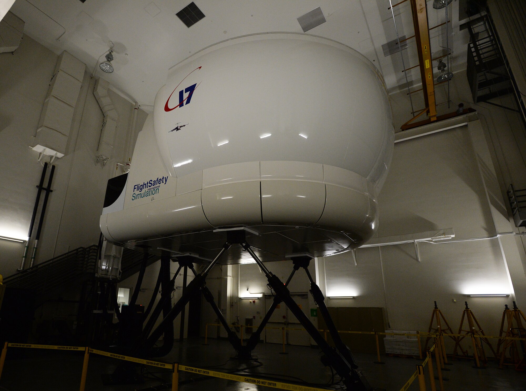 A C-17 Globemaster III flight simulator sits ready for pilots to board before a training session at Joint Base Pearl Harbor-Hickam, Hawaii, Feb. 18, 2014. Hickam C-17 pilots conduct training in the 30-foot-high machine, simulating realistic scenarios in order to stay current on training requirements. (U.S. Air Force photo/Staff Sgt. Alexander Martinez)