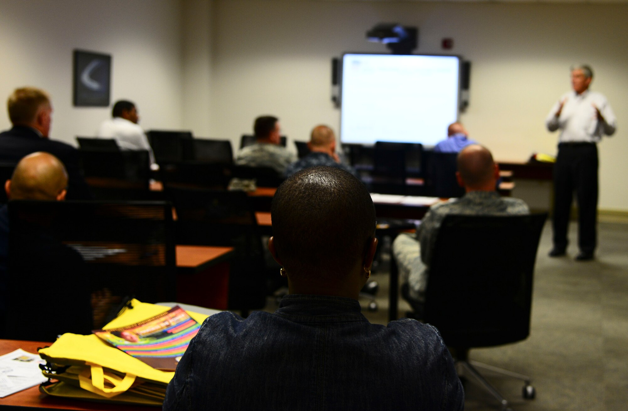 Participants listen during a Troops to Teachers seminar held on Feb. 20, 2014 at MacDill Air Force Base, Fla. The program helps eligible military personnel begin a new career as teachers in public schools where their skills, knowledge and experience are most needed. (U.S. Air Force photo by Senior Airman Jenay Randolph/Released)