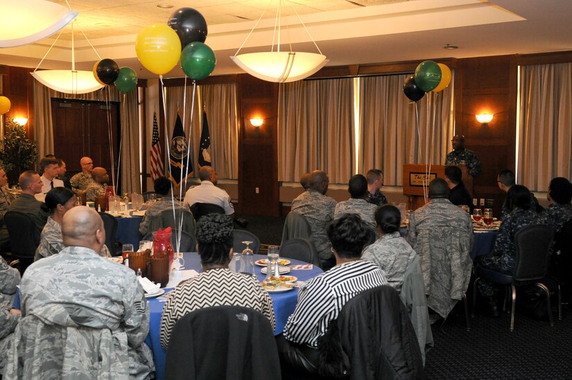 Team Andrews members gather at the club at Joint Base Andrews, Md., for a Black History Month luncheon in honor of the 50th anniversary of the Civil Rights Act, on Feb. 19, 2014. Lt. Cmdr. Bryan Pettigrew, Navy Information Dominance Corps., Region of Washington, D.C., assistant officer in charge, was the guest speaker for the event. (U.S. Air Force photo/Airman 1st Class Ryan J. Sonnier)