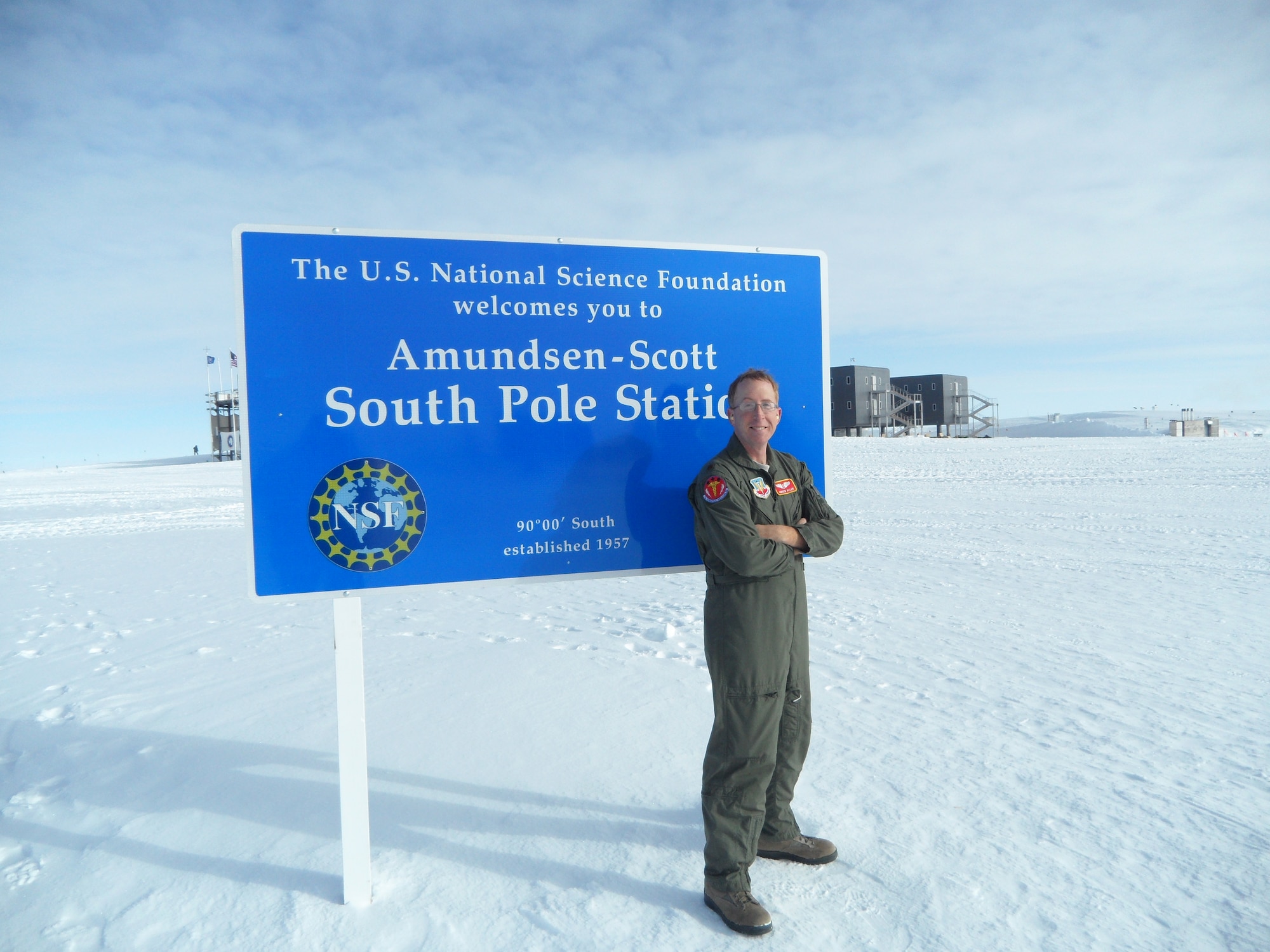 U.S. Air Force Maj. Andrew Allen, 7th Aerospace Medicine Squadron, stands near the South Pole Jan. 10, 2014, at Amundsen Scott South Pole Station, Antarctica. When they were not busy with walk-ins, follow up appointments, studying or training, Allen’s team had opportunities to observe the unique landscapes and wild life of Antarctica. (Courtesy photo) 