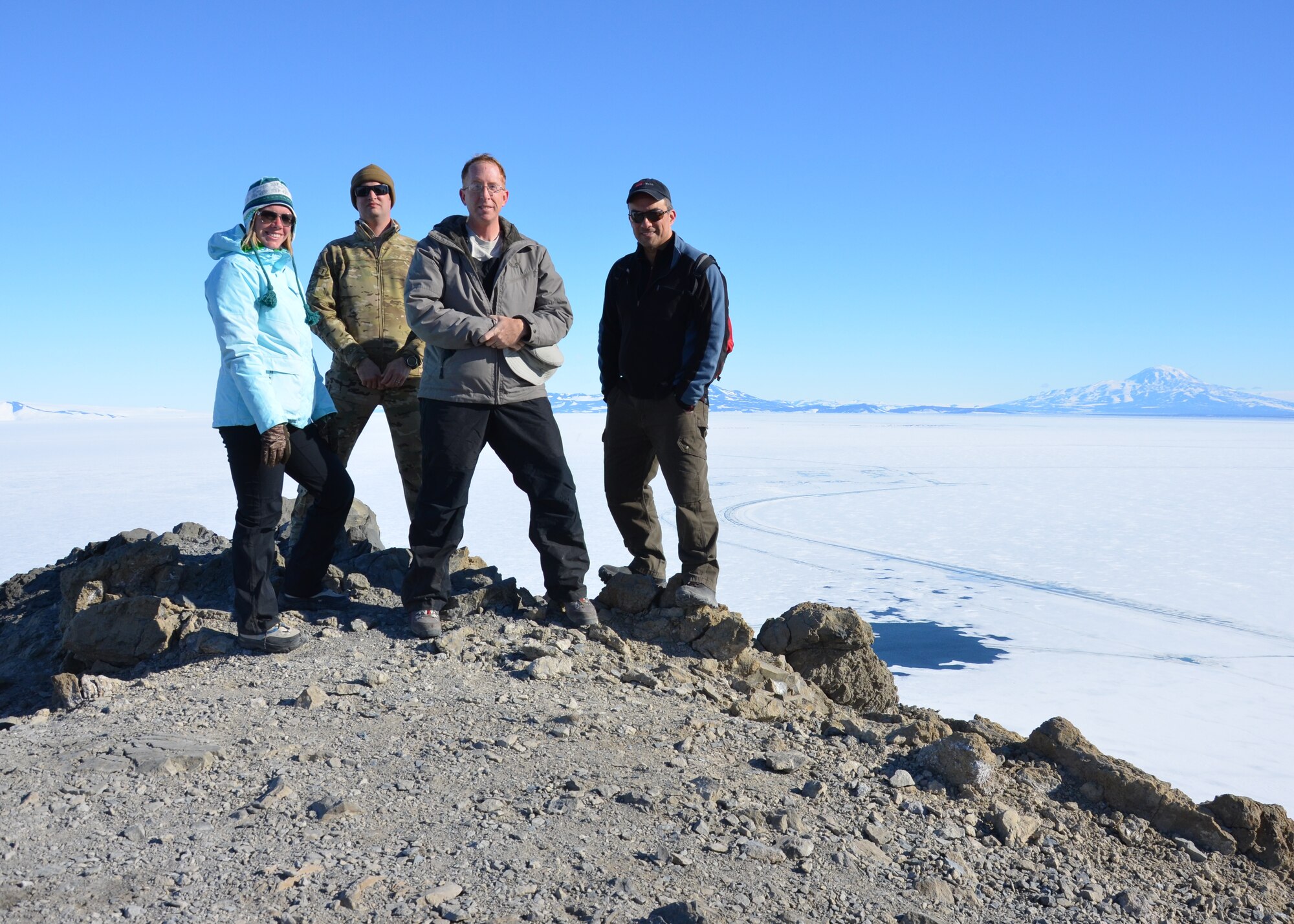 U.S. Air Force Maj. Andrew Allen, 7th Aerospace Medicine Squadron, stands atop Observation Hill with his aerospace medicine team Jan. 8, 2014, at McMurdo Station, Ross Island, Antarctica. During his deployment, Allen was responsible for the McMurdo Station clinic which accommodates the nearly 1,200 residents that call the station home during the summer. (Courtesy photo)