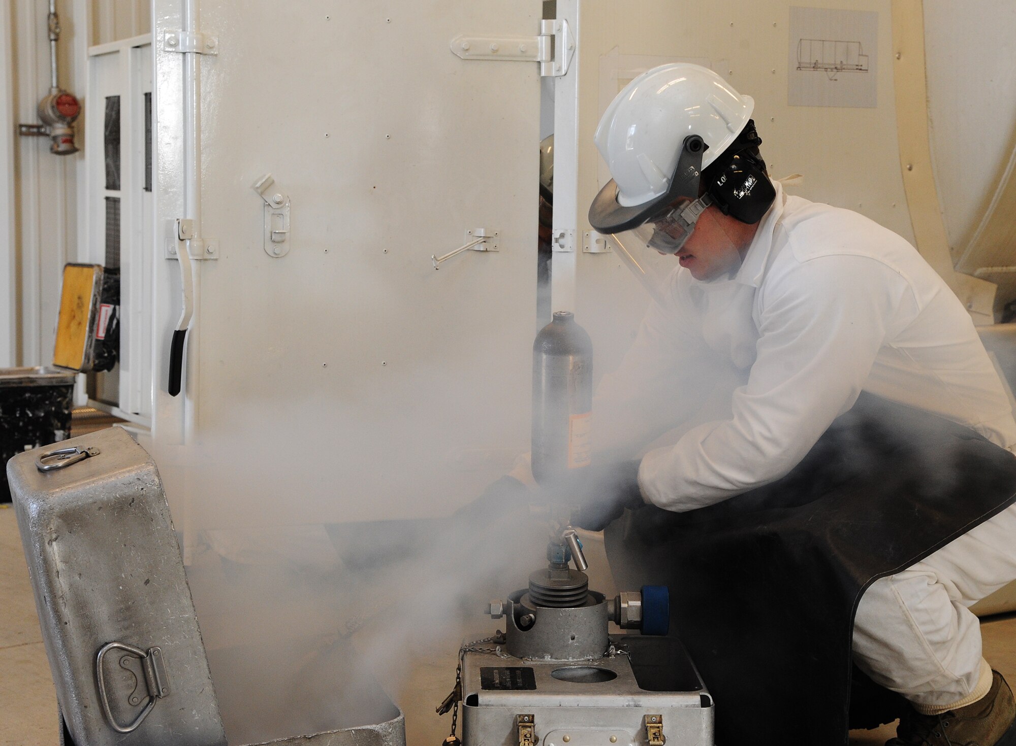 Senior Airman Cole Peck, 5th Logistics Readiness Squadron base fuels laboratory technician, opens a valve during extraction of liquid oxygen to be sent to Wright Patterson Air Force Base, Ohio. Peck follows checklists during every point of an extraction process to ensure the procedure is executed correctly and safely. (U.S. Air Force photo/Senior Airman Andrew Crawford)