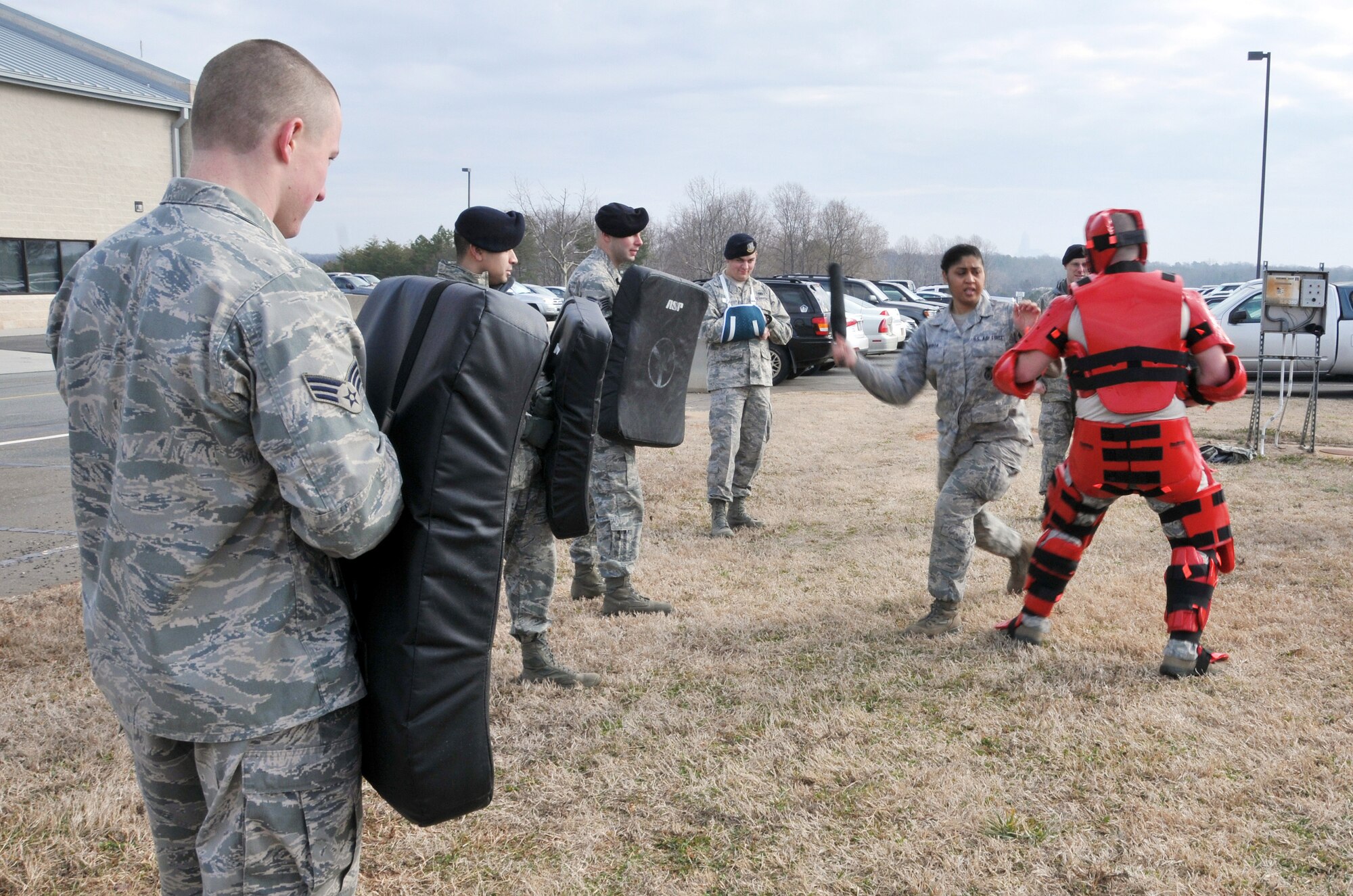 Members assigned to the 145th Security Forces Squadron, use ASP Baton Strike Pad and collapsible ASP batons during a training held at North Carolina Air National Guard base, Charlotte Douglas Intl. airport, February 9, 2014.  Security Forces must keep their certification in non-lethal ASP as part of their yearly requirements. (U.S. Air National Guard photo by Senior Airman Laura Montgomery, 145th Public Affairs/Released