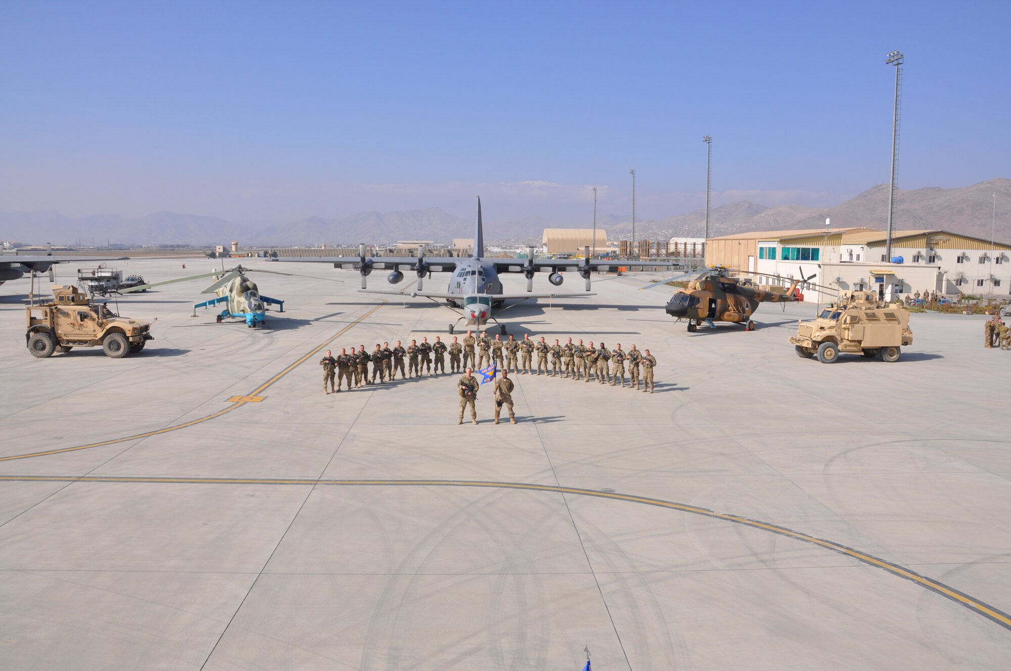 Members of the 439th Air Expeditionary Advisory Squadron stand together at Kabul International Airport, Afghanistan.  The 439th AEAS's mission is to provide security to advisors training AAF.