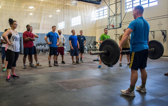 Tech. Sgt. Allen Foster, 437th Maintenance Squadron assistant flight chief, displays the proper lifting technique Feb. 20, 2014, at the Fitness Center on Joint Base Charleston – Air Base, S.C. Lifting weights incorrectly may lead to sprains, strains, fractures and other painful injuries. (U.S. Air Force photo/ Airman 1st Class Clayton Cupit)