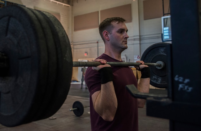 Airman 1st Class Jake Palmer, 628th Medical Group public health technician, concentrates on his weight lifting form   Feb. 19, 2014, at the Fitness Center on Joint Base Charleston – Air Base, S.C. The CrossFit program is designed to be scalable, where every exercise is modified to each individual’s capabilities, making it a great workout regardless of fitness level. (U.S. Air Force photo/ Airman 1st Class Clayton Cupit)