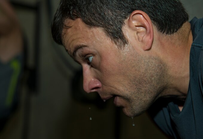 Maj. Christopher Marsh, 315th Airlift Wing pilot, cools down after a vigorous workout Feb. 19, 2014, at the Fitness Center on Joint Base Charleston – Air Base, S.C. CrossFit exercises involve constantly varied functional movements performed at a relatively high intensity. (U.S. Air Force photo/ Airman 1st Class Clayton Cupit)