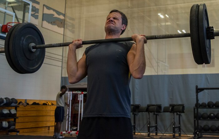 Maj. Christopher Marsh, 315th Airlift Wing pilot, executes a shoulder-to-overhead lift Feb. 19, 2014, at the Fitness Center on Joint Base Charleston – Air Base, S.C. The CrossFit program is designed to be scalable, where every exercise is modified to each individual’s capabilities, making it a great workout regardless of fitness level. (U.S. Air Force photo/ Airman 1st Class Clayton Cupit)