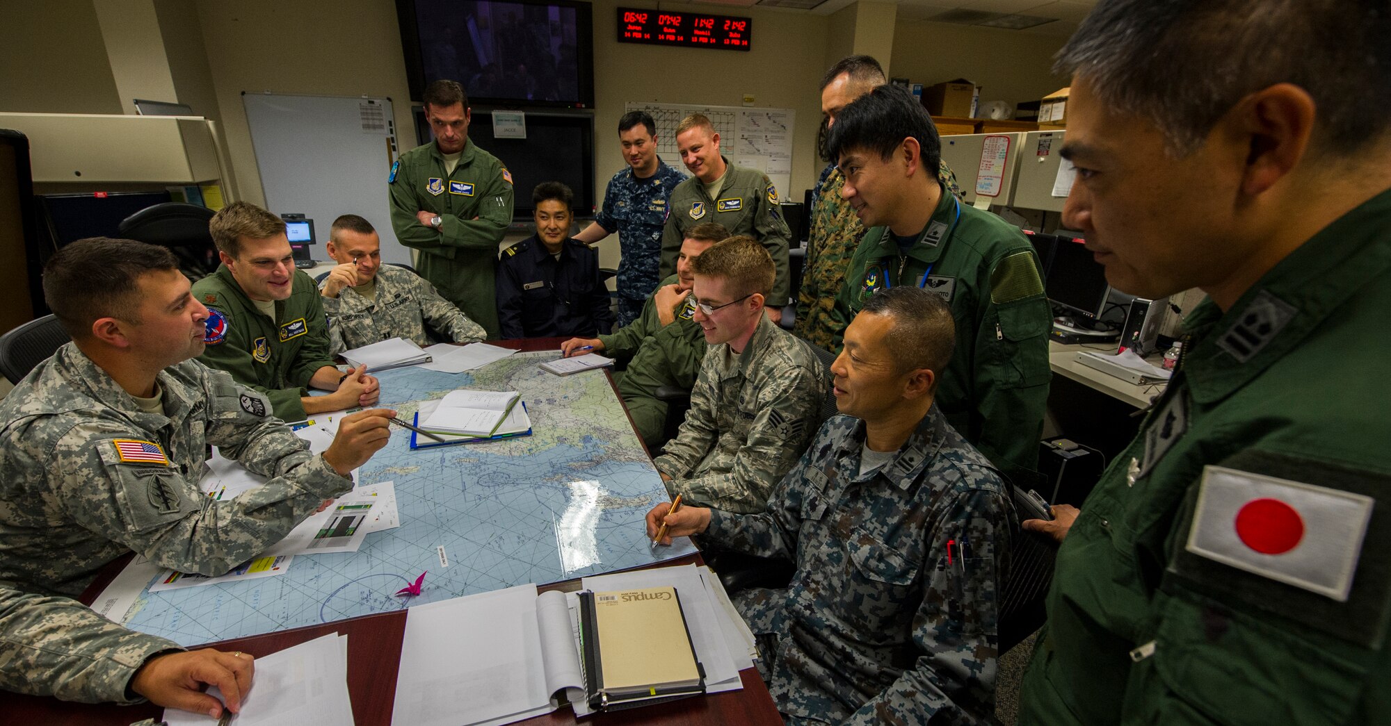 Planners from the U.S. military and Japan Self-Defense Forces engage in missile defense planning during the Integrated Air and Missile Defense Wargame V on Feb. 13, 2014, in the 613th Air Operations Center at Joint Base Pearl Harbor Hickam, Hawaii. The exercise centered around building relationships between the joint U.S. team and Japan's military forces to overcome regional security challenges. (U.S. Air Force photo by Staff Sgt. Nathan Allen)