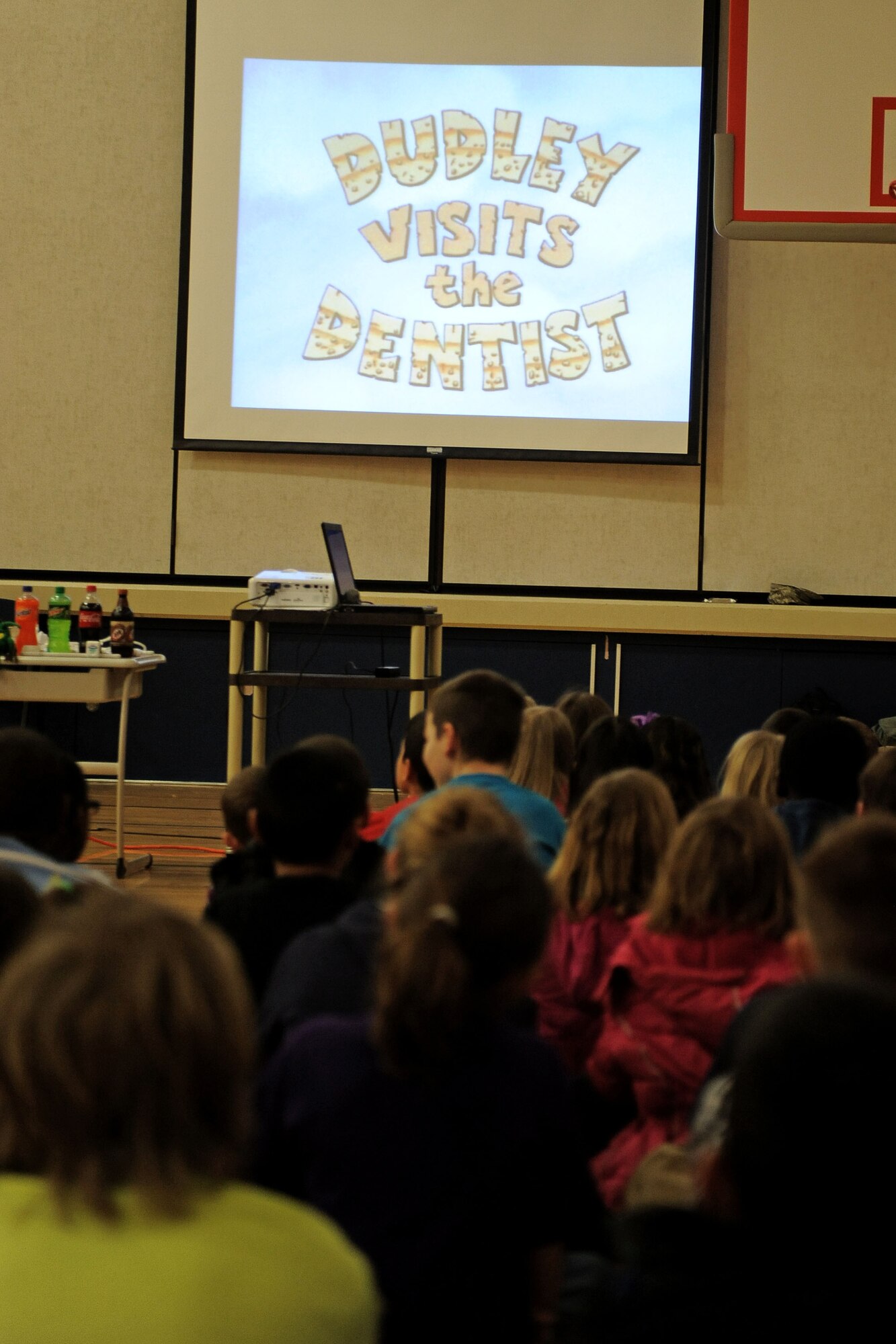 Students of Michael Anderson Elementary School watch an informative cartoon video about proper dental cleaning at Fairchild Air Force Base, Wash., Feb. 20, 2014. Members of the dental clinic hosted an event in honor of National Children’s Dental Health Month. (U.S. Air Force photo by Senior Airman Taylor Curry/Released)