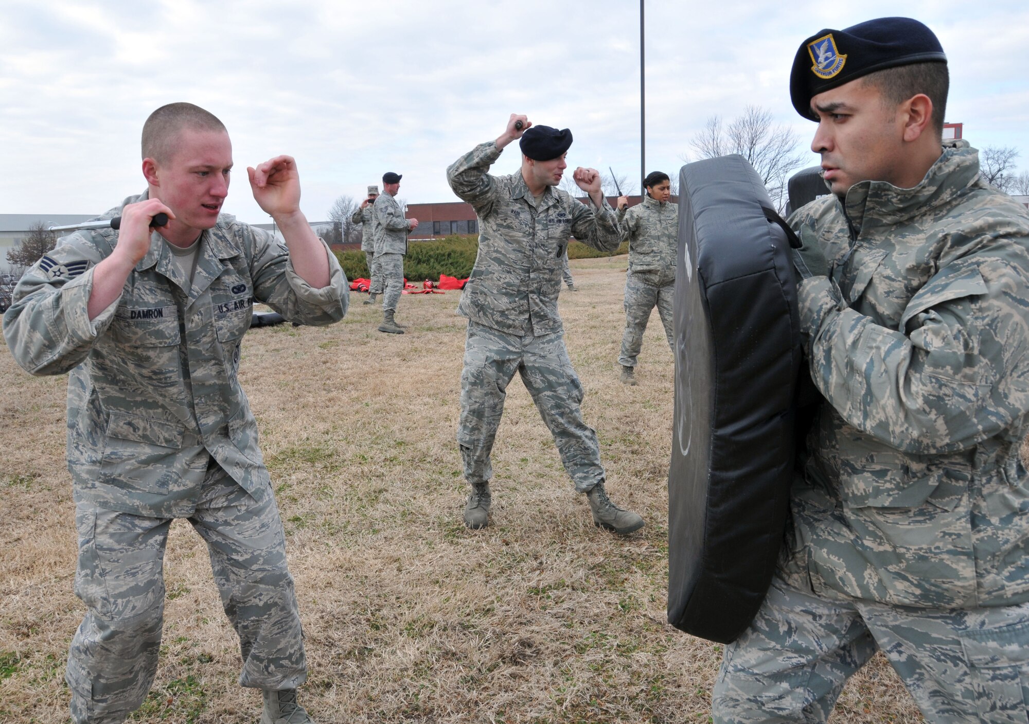 U.S. Air Force Staff Sgt. Norman Dias, 145th Security Forces Squadron, holds on to the ASP Baton Strike Pad as Senior Airman Nicholas Damron prepares to strike during a non-lethal defense training exercise held at the North Carolina Air National Guard base, Charlotte Douglas Intl. Airport, February 9, 2014.  Security Forces must keep their certification in non-lethal ASP current as part of their yearly requirements. (U.S. Air National Guard photo by Staff Sgt. Pamela Robbins, 145th Public Affairs/Released) 