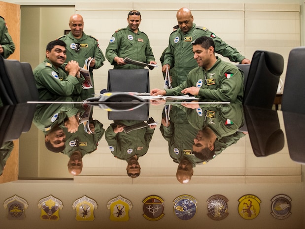 Five members of the Kuwait Air Force review Joint Base Charleston’s base newspaper, “The Patriot” in which they were featured. The crew transited through Joint Base Charleston – Air Base, Feb. 14, 2014, en route to Kuwait, where they delivered their nation’s first C-17 Globemaster III.  (U.S. Air Force photo/ Senior Airman Dennis Sloan)