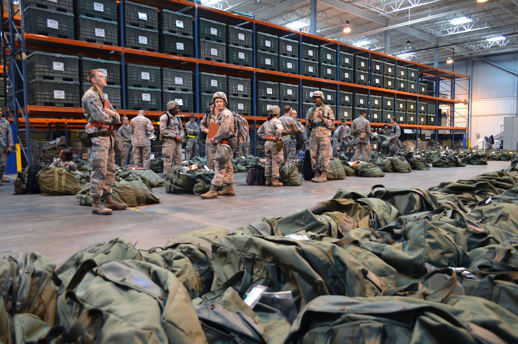 Airmen from the 43d Airlift Group participate in a mobility exercise here Feb. 20. The four-day exercise prepared 153 personnel and 200 short tons of equipment for deployment. The objectives of the exercise were to assess and evaluate the readiness of the Group, the installation deployment plan, identify process improvement opportunities, command and control, 24-hour operations and fulfill deployment planning and execution requirement to exercise personnel and cargo deployment functions at Pope Army Airfield, Fort Bragg, N.C. (U.S. Air Force photo/Marvin Krause)