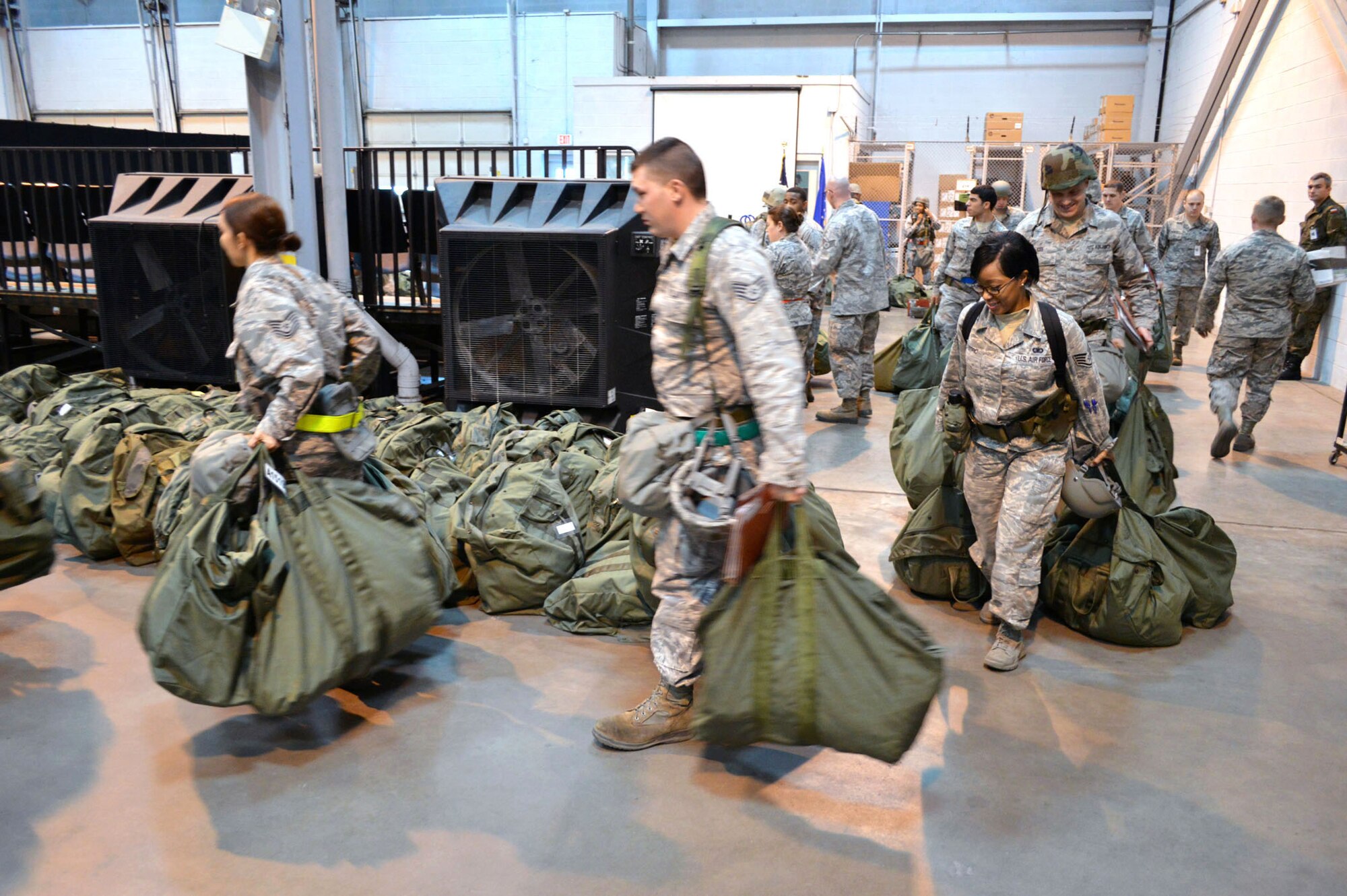 Airmen from the 43d Airlift Group participate in a mobility exercise here Feb. 20. The four-day exercise prepared 153 personnel and 200 short tons of equipment for deployment. The objectives of the exercise were to assess and evaluate the readiness of the Group, the installation deployment plan, identify process improvement opportunities, command and control, 24-hour operations and fulfill deployment planning and execution requirement to exercise personnel and cargo deployment functions at Pope Army Airfield, Fort Bragg, N.C. (U.S. Air Force photo/Marvin Krause)