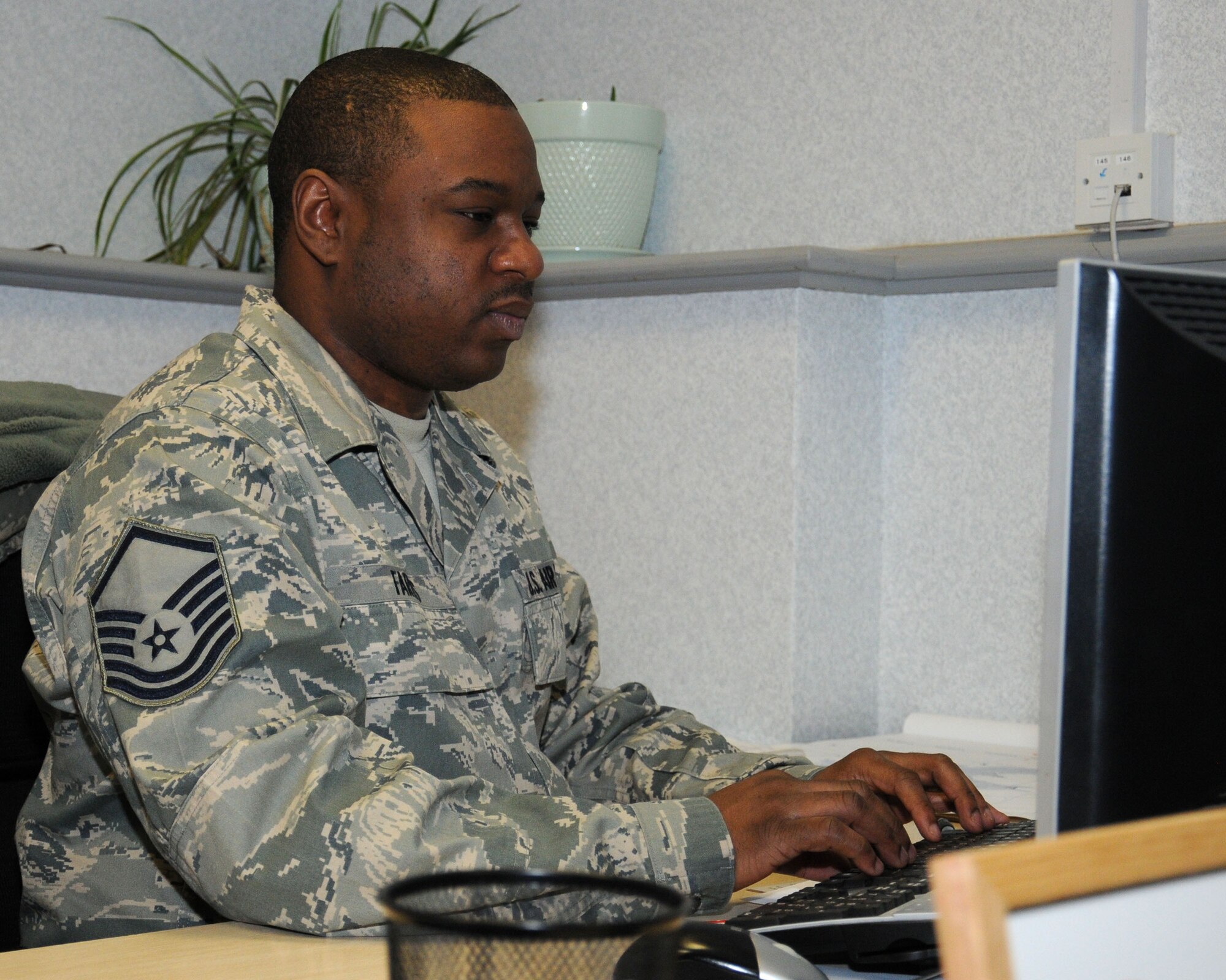 U.S. Air Force Master Sgt. Rodrick Farris, 100th Logistics Readiness Squadron Quality Assurance evaluator from Slaton, Texas, verifies references after conducting an inspection Feb. 14, 2014, on RAF Mildenhall, England. In the 100th LRS, it’s the job of the QA team to ensure its members are completing their daily tasks safely. It’s also the team’s job to ensure its members are in compliance with both U.K. and U.S. regulations and checklists. (U.S. Air Force photo by Gina Randall/Released)