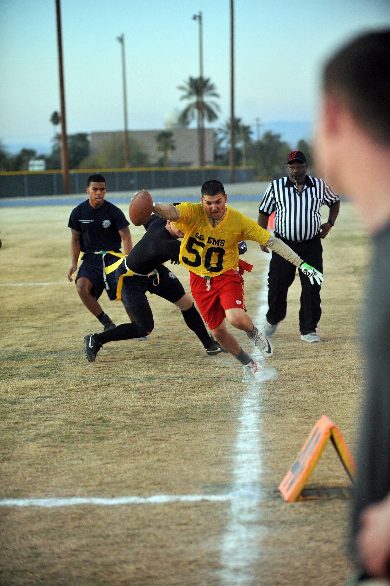 Jonathan Juarez-Chavez, 56th Equipment Squadron cornerback, runs an intercepted catch back up the field Feb. 13 at Luke Air Force Base. Despite a fierce defense, EMS lost the game to the 56th Civil Engineer Squadron 19-13. (U.S. Air Force photo/Senior Airman Jason Colbert)