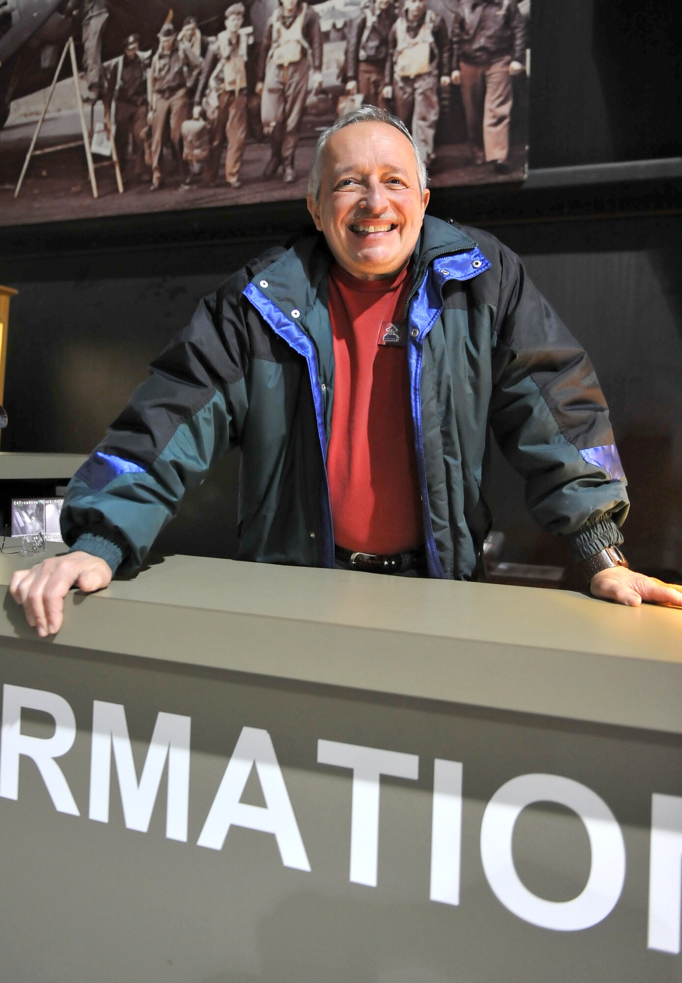 Karl Demello, Museum of Aviation volunteer who works as a greeter in the World War II Building, always welcomes visitors with a smile. (U.S. Air Force Photo by Tommie Horton)