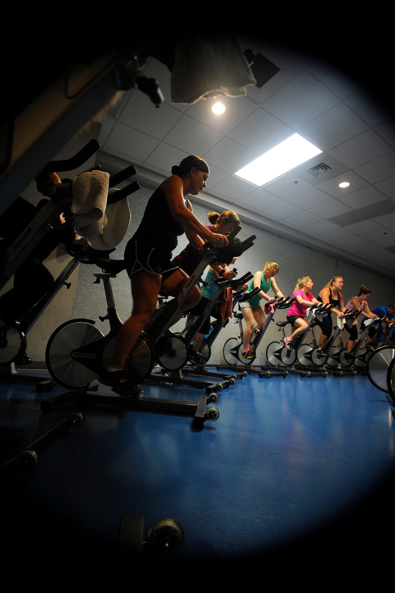 Spin class participants simulate riding through a mountainous range at the Aderholt Gym on Hurlburt Field, Fla., Feb. 20, 2014. The spin bikes at the gym use resistance to mimic flat and mountainous ranges. (U.S. Air Force photo/Airman 1st Class Andrea Posey)