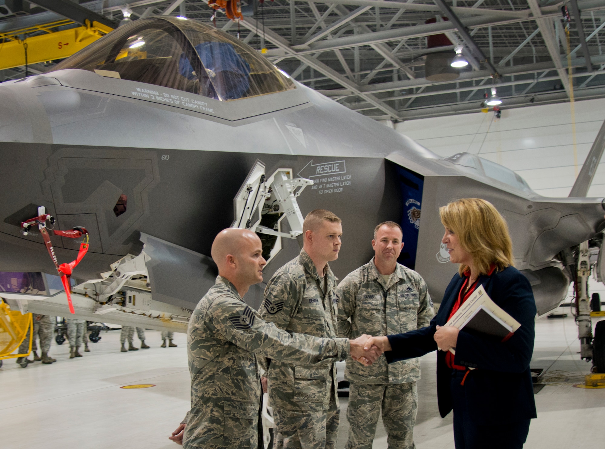 Secretary of the Air Force Deborah Lee James meets with 33rd Fighter Wing F-35A Lightning II maintainers Feb. 19 at Eglin Air Force Base, Fla.  Her visit focused primarily on the joint strike fighter with visits to the Academic Training Center and reprograming lab, and meeting with pilots and maintainers.  (U.S. Air Force photo/Samuel King Jr.)