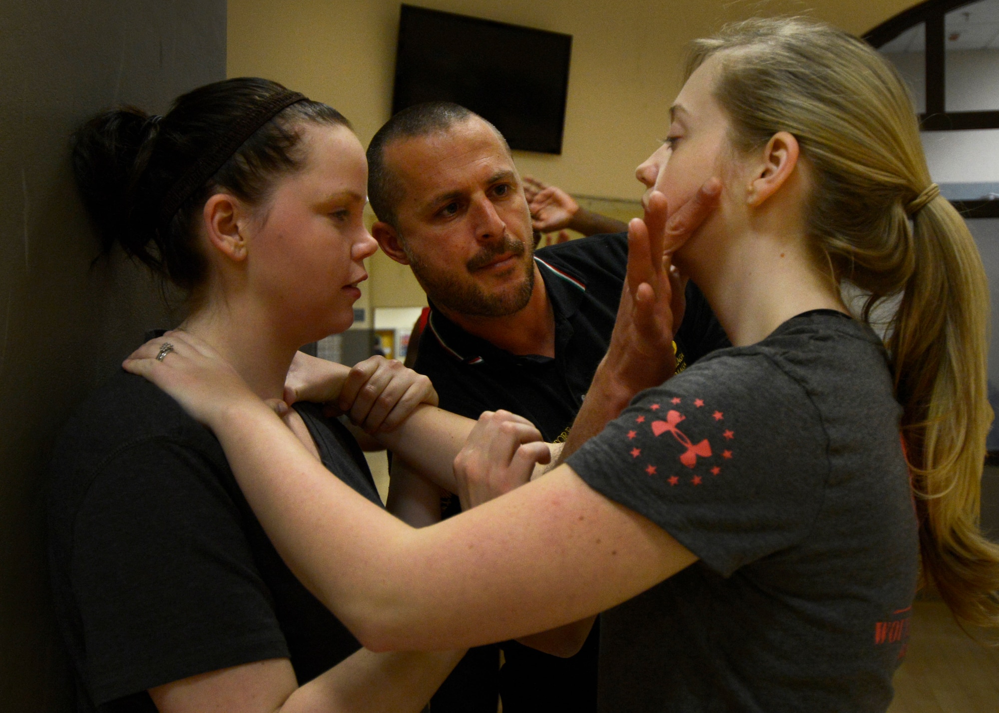 Mauro Vazzoler, Krav Maga instructor, teaches students a self-defense move, Feb. 19, 2014, at the Dragon Fitness Center on Aviano Air Base, Italy. The Dragon Fitness Center offers Krav Maga classes on Wednesdays from 7:30 to 9 p.m. and cost $45 per person for four classes. (U.S. Air Force photo/Senior Airman Gina Gonzalez Hernandez)