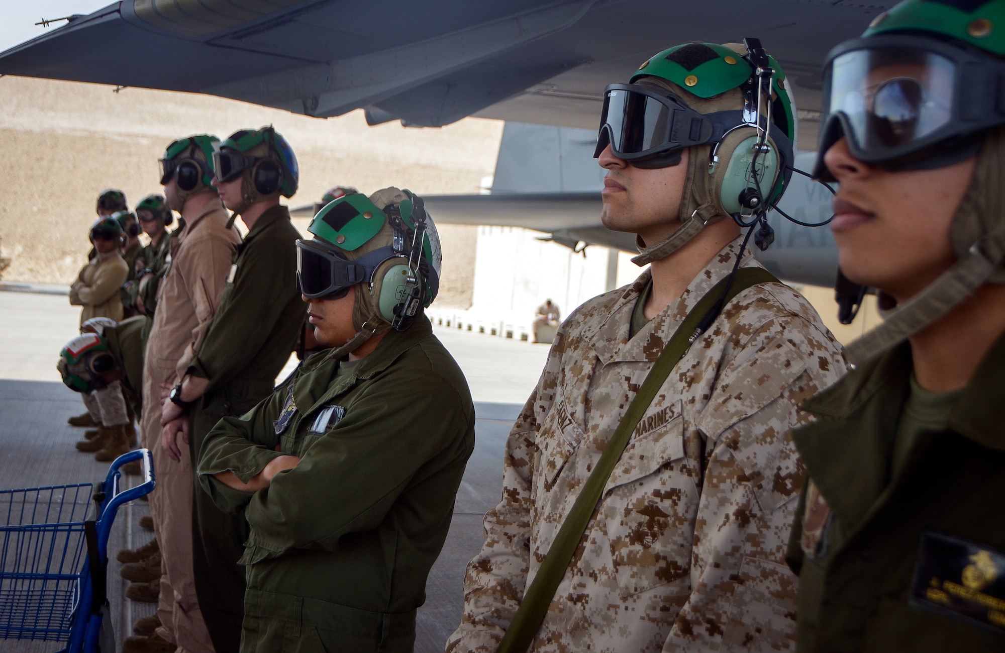 Marines from the Tactical Electronic Warfare Squadron 3 (VMAQ-3) “Moondogs” wait for diagnostics during a preflight inspection on an EA-6B Prowler at Al Udeid Air Base, Qatar, Feb. 18, 2014. The EA-6B Prowler is a four-seat, twin-engine tactical electronic attack aircraft capable of attacking and jamming enemy radio, communications and radar operations. The Prowlers who were previously deployed to Afghanistan have been moved to AUAB and are currently being supported by more than 200 Marines from Marine Corps Air Station Cherry Point, N.C. (U.S. Air Force photo/Senior Airman Jared Trimarchi)
