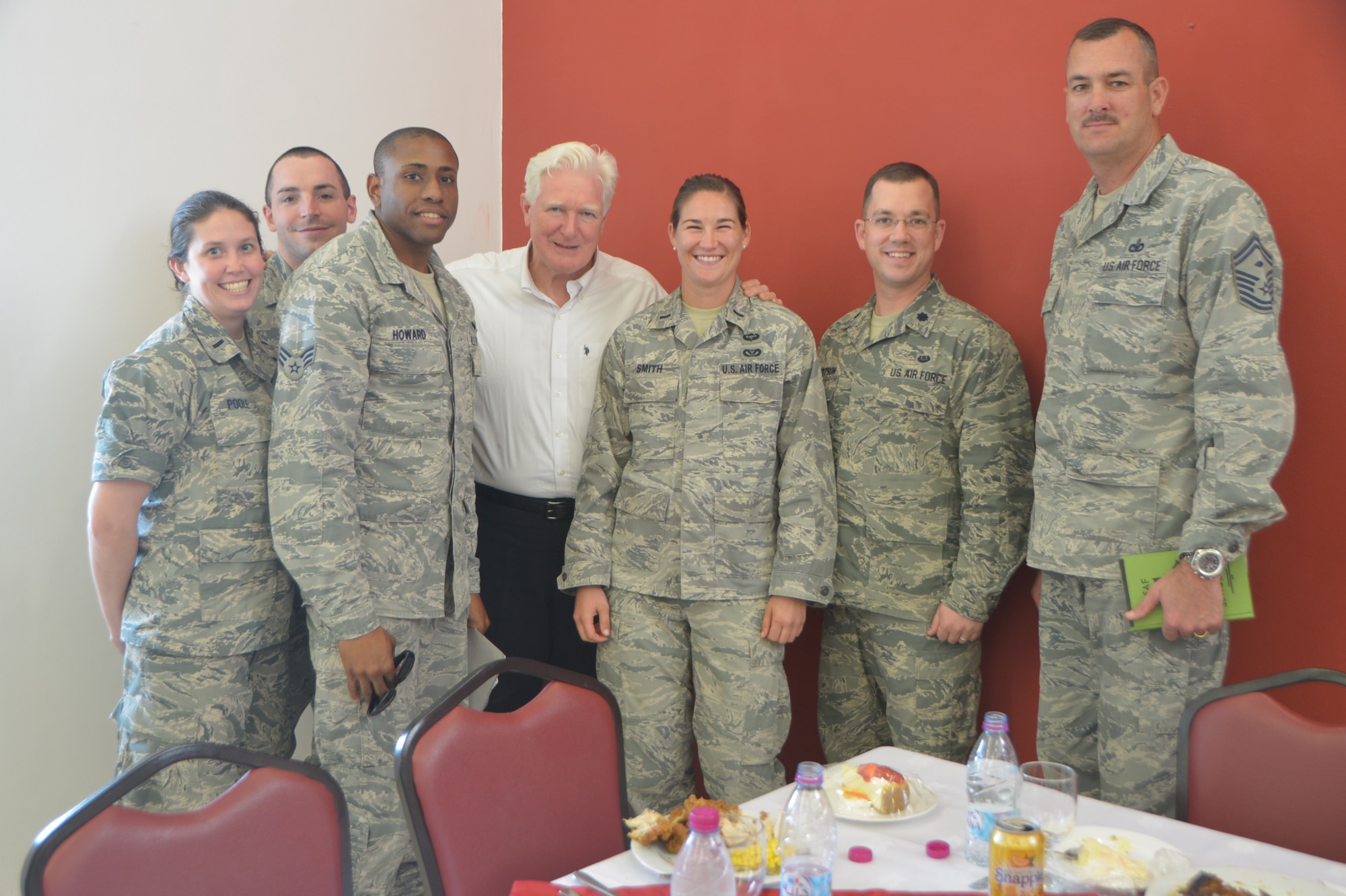 Congressman James Moran (D-Va.) poses with Airmen who are from the state of Virginia after a lunch in at Al Udeid Air Base, Qatar, Feb. 18, 2014. Three other congressmen from the House of Appropriations Committee, Peter Visclosky (D-Ind.), Rodney Frelinghuysen (R-N.J.) and Ken Calvert (R-Calif.) were also here to visit five Air Force airframes and were briefed on the capability of multiple units on base who support the U.S. Air Forces Central Command area of responsibility and Operation Enduring Freedom. The congressmen also had lunch with Airmen who are from their represented state to discuss any concerns and thank the service members for their hard work. (U.S. Air Force photo/Senior Airman Jared Trimarchi)
