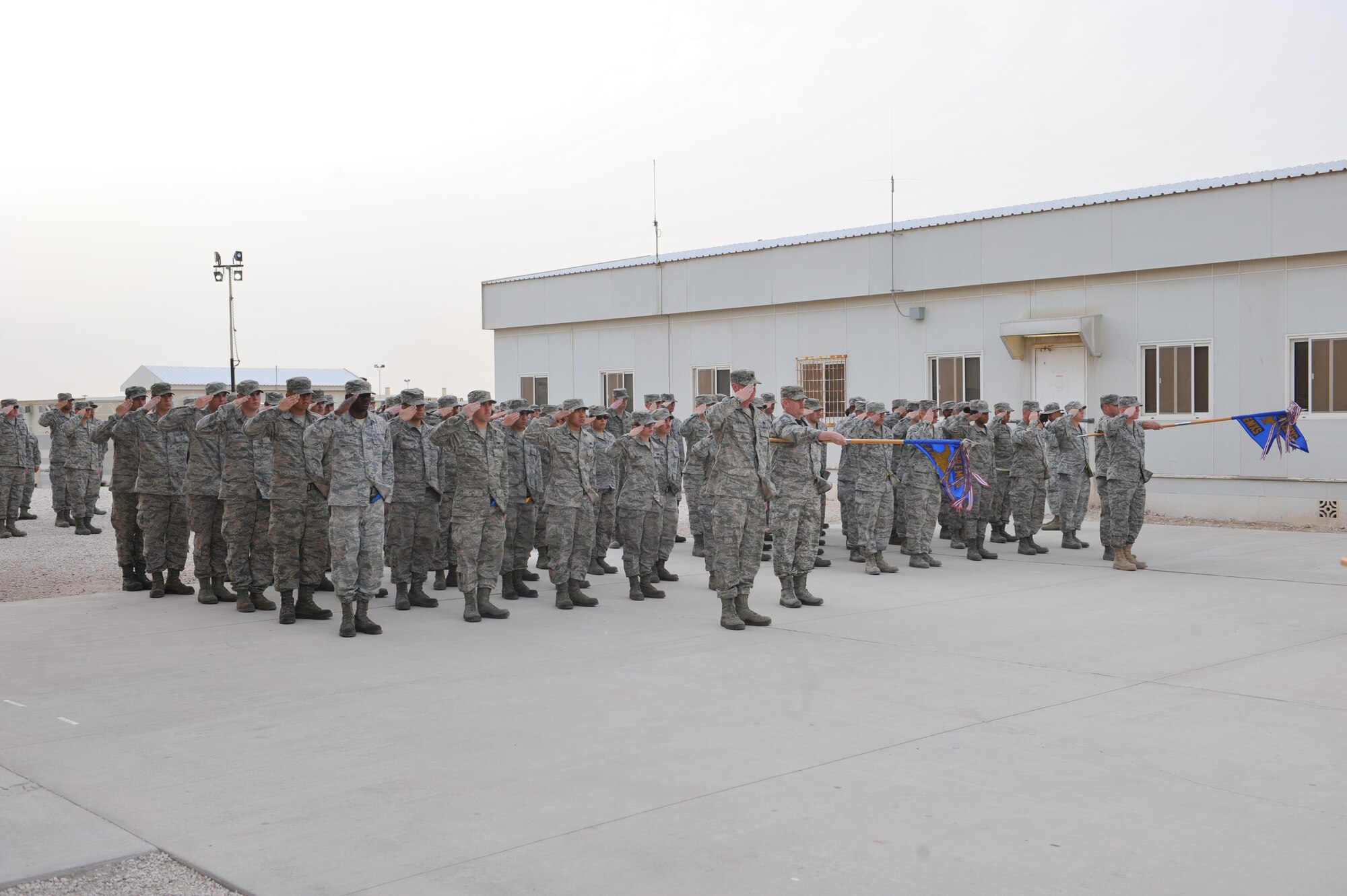 Airmen from the 379th Expeditionary Maintenance Group salute the U.S. Flag during a Presidents Day retreat ceremony at Al Udeid Air Base, Qatar, Feb. 17, 2014. In 1951, the desire for a more generalized recognition of Presidential achievements surfaced and collided with a movement to standardize the observance of certain holidays on Mondays, which would later come to be known as the “Uniform Monday Holiday Act”. Contrary to popular belief, the act neither combined the birthday celebrations for Presidents George Washington and Abraham Lincoln nor actually changed the holiday’s official name to Presidents Day.  (U.S. Air Force photo/Master Sgt. David Miller) 