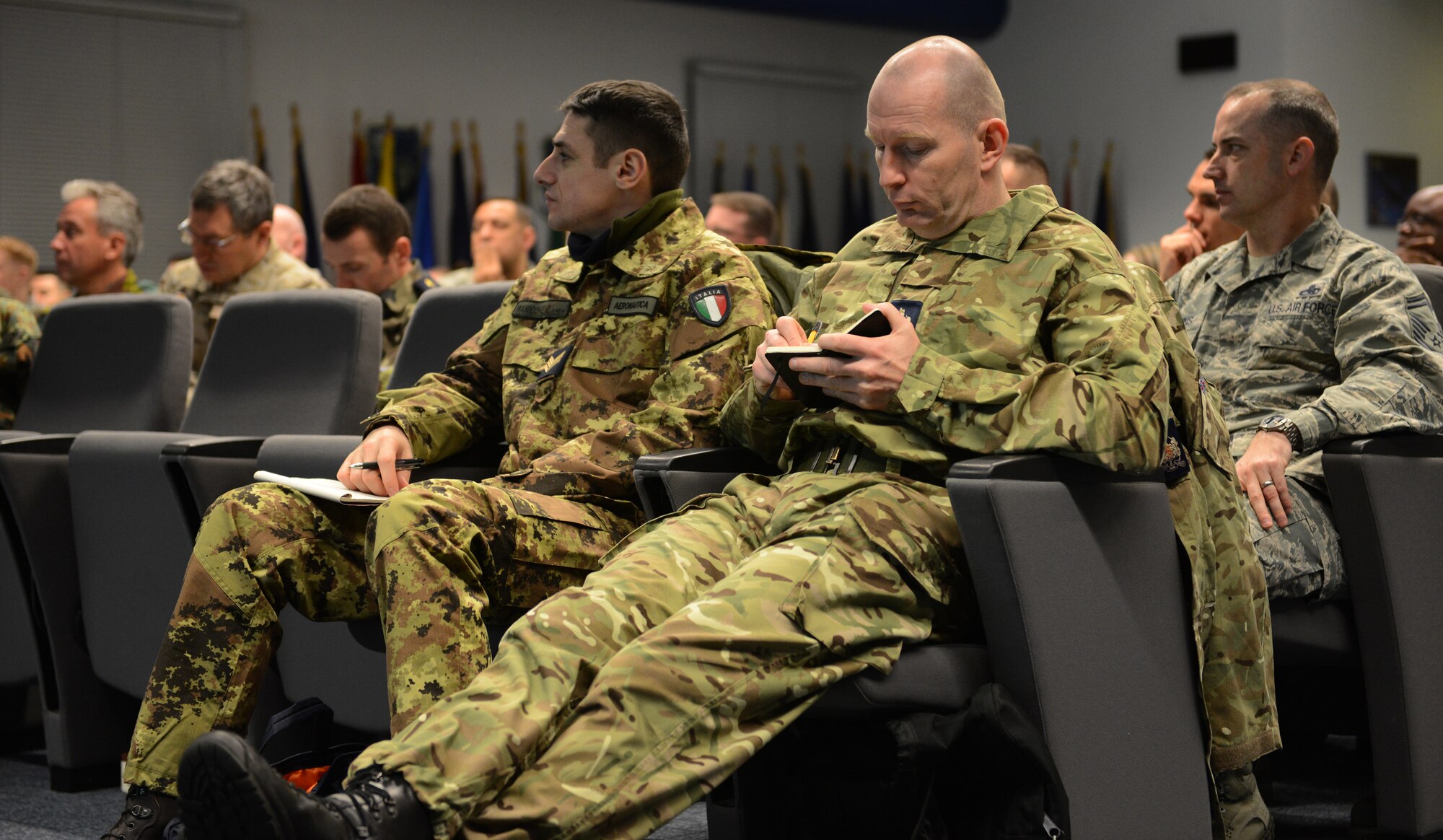 KAPAUN AIR STATION, Germany --  Station Warrant Officer Gary Prytherch, Royal Air Force, takes notes during the Kaiserslautern Military Community First Sergeant Council's Additional Duty First Sergeant Symposium here Feb. 19. Prytherch joined more than 120 non-commissioned officers from nine nations to learn about the roles and responsibilities of a U.S. Air Force first sergeant. (U.S. Air Force Photo by Tech. Sgt. James M. Hodgman) 