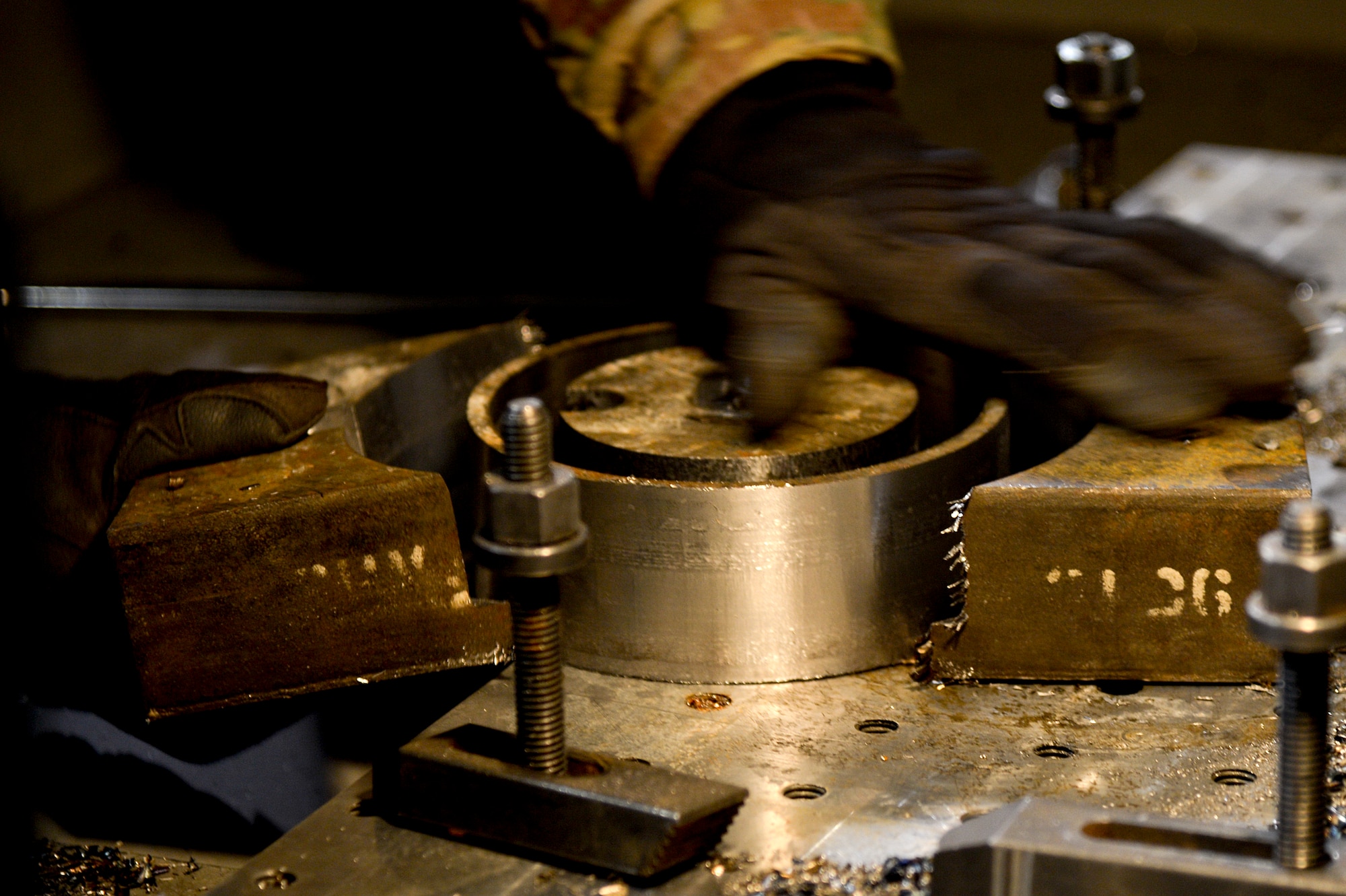 U.S. Air Force Tech. Sgt. Alex Introini, 455th Expeditionary Maintenance Squadron aircraft machinist and welder, separates the pieces around a forward fuel pylon attach fitting wrench kit at Bagram Airfield, Afghanistan, Feb. 20, 2014. The part is used for the external fuel tank pylons on the F-16 Fighting Falcons. Introini is deployed from Homestead Air Reserve Base, Fla., and a native of Miami, Fla. (U.S. Air Force photo by Senior Airman Kayla Newman/Released)