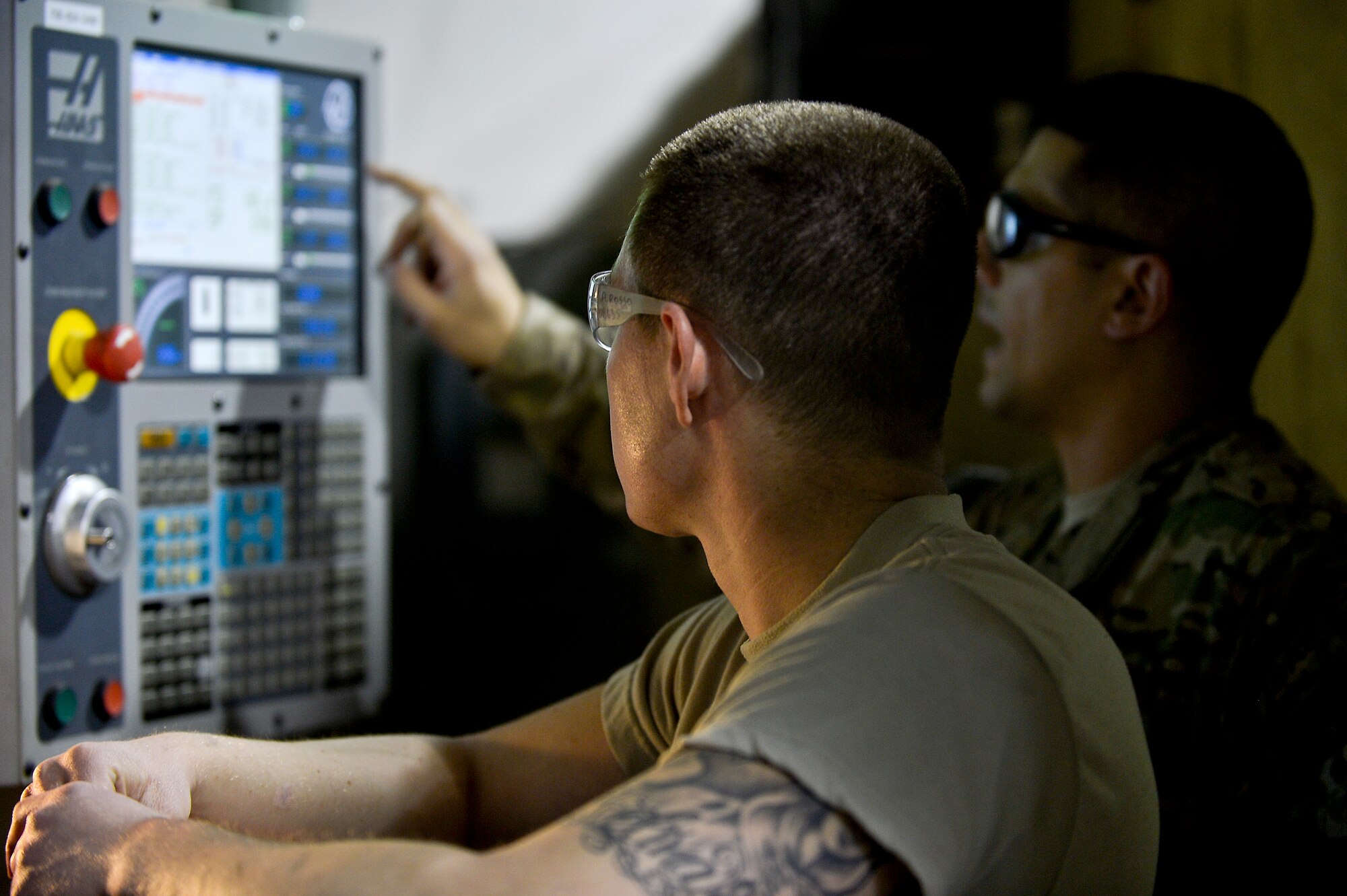 U.S. Air Force Senior Airman Allan Rosso, 455th Expeditionary Maintenance Squadron aircraft metals technologist, operates a machine used for making forward fuel pylon attach fitting wrench kits at Bagram Airfield, Afghanistan, Feb. 20, 2014. The part is used for the external fuel tank pylons on the F-16 Fighting Falcons. Rosso is deployed from Moody Air Force Base, Ga., and a native of Porterville, Calif. (U.S. Air Force photo by Senior Airman Kayla Newman/Released)