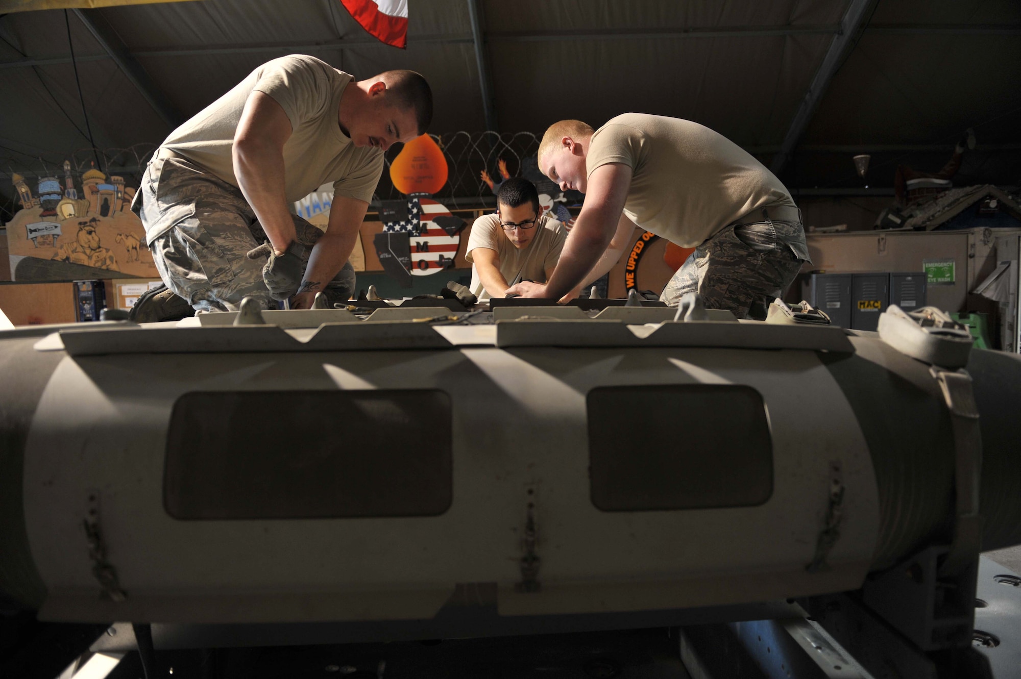 Airmen assigned to the a 379th Expeditionary Maintenance Squadron conventional munitions flight perform a six-month Assembled Munitions Serviceability Inspection on a Joint Direct Attack Munition. AMSIs are conducted to ensure all munitions components are serviceable and within the service life dates. The JDAMs are built and loaded on B-1B Lancers that support Operation Enduring Freedom. The majority of the munitions flight is deployed from Ellsworth Air Force Base, S.D. (U.S. Air Force photo by Master Sgt. David Miller)