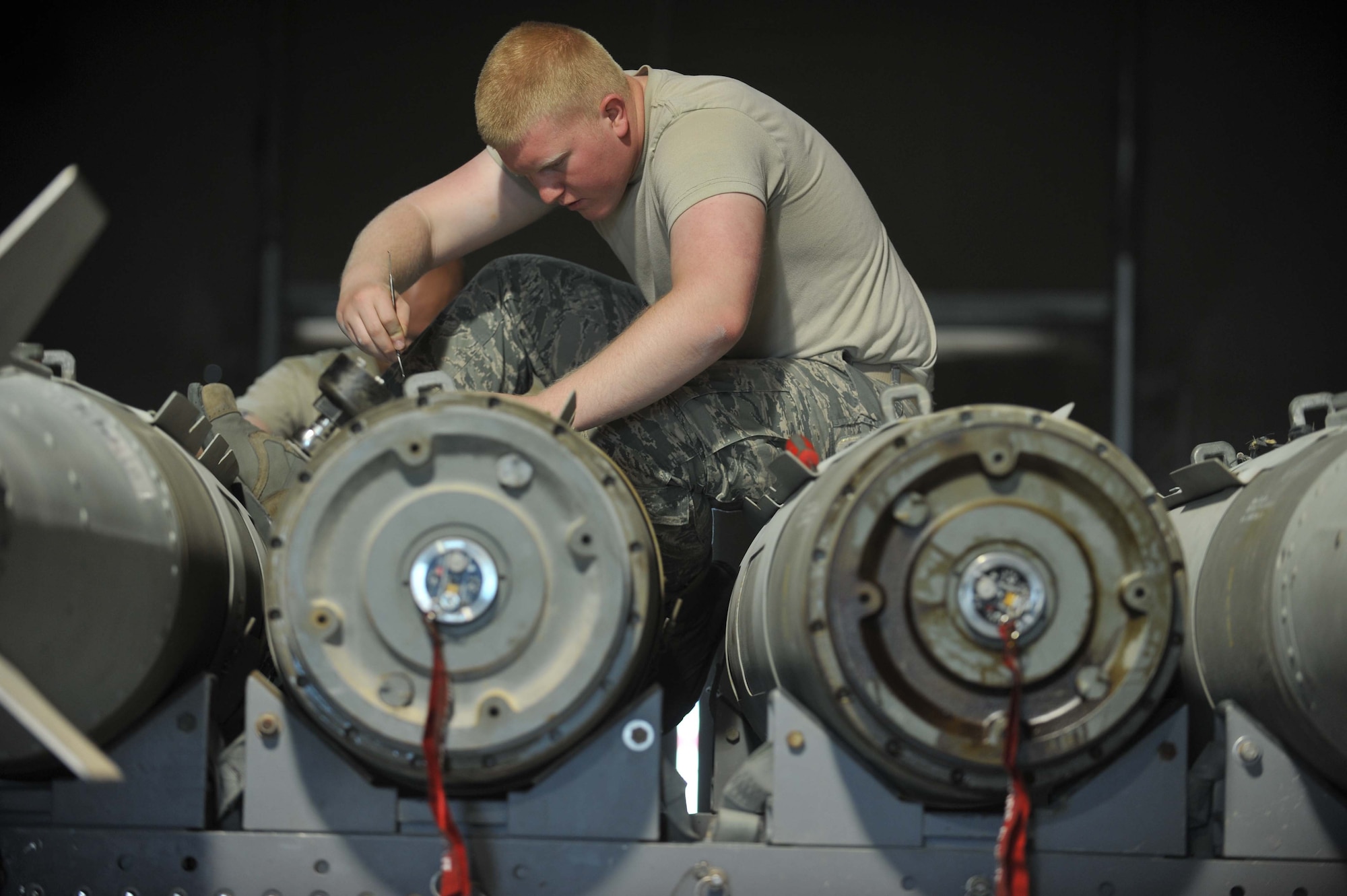 Airman 1st Class Connor Howard removes a bomb fuze initiator (FZU-55) for inspection during a six-month Assembled Munitions Serviceability Inspection on a Joint Direct Attack Munition. AMSIs are conducted to ensure all munitions components are serviceable and within the service life dates. The JDAMs are built and loaded on B-1B Lancers that support Operation Enduring Freedom. Howard is a 379th Expeditionary Maintenance Squadron conventional munitions maintenance crew member deployed from Ellsworth Air Force Base, S.D., and a Carroll, Iowa native. (U.S. Air Force photo by Master Sgt. David Miller)