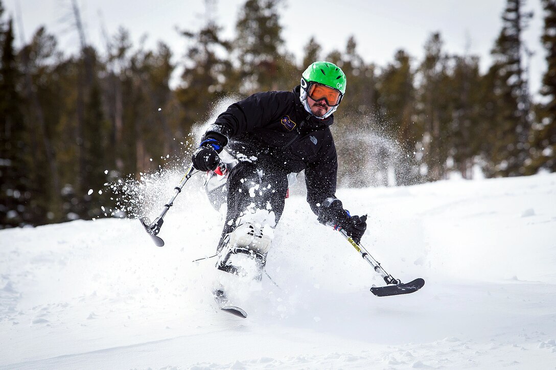 Former Marine and wounded warrior Carlos Torres rides a mono ski down the slopes
at Big Sky Ski Resort, Mont., Feb. 13, 2014.