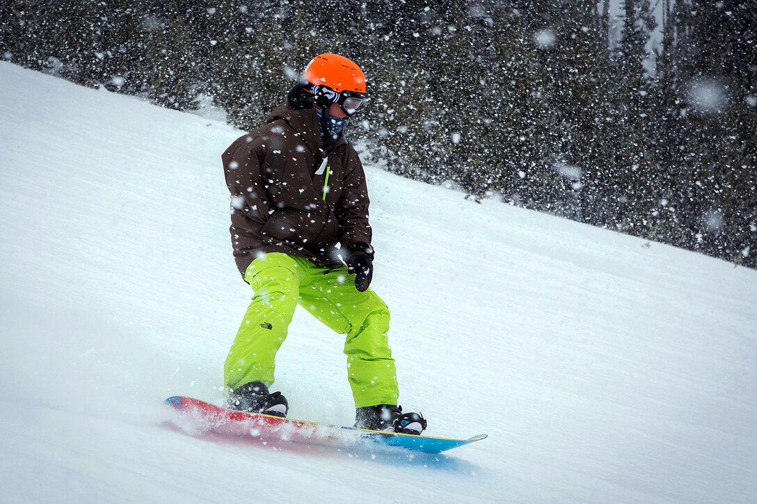 Former Marine and wounded warrior Derek Goodridge snowboards during a week of therapeutic skiing down the slopes at Big Sky Ski Resort, Mont., Feb. 14, 2014.