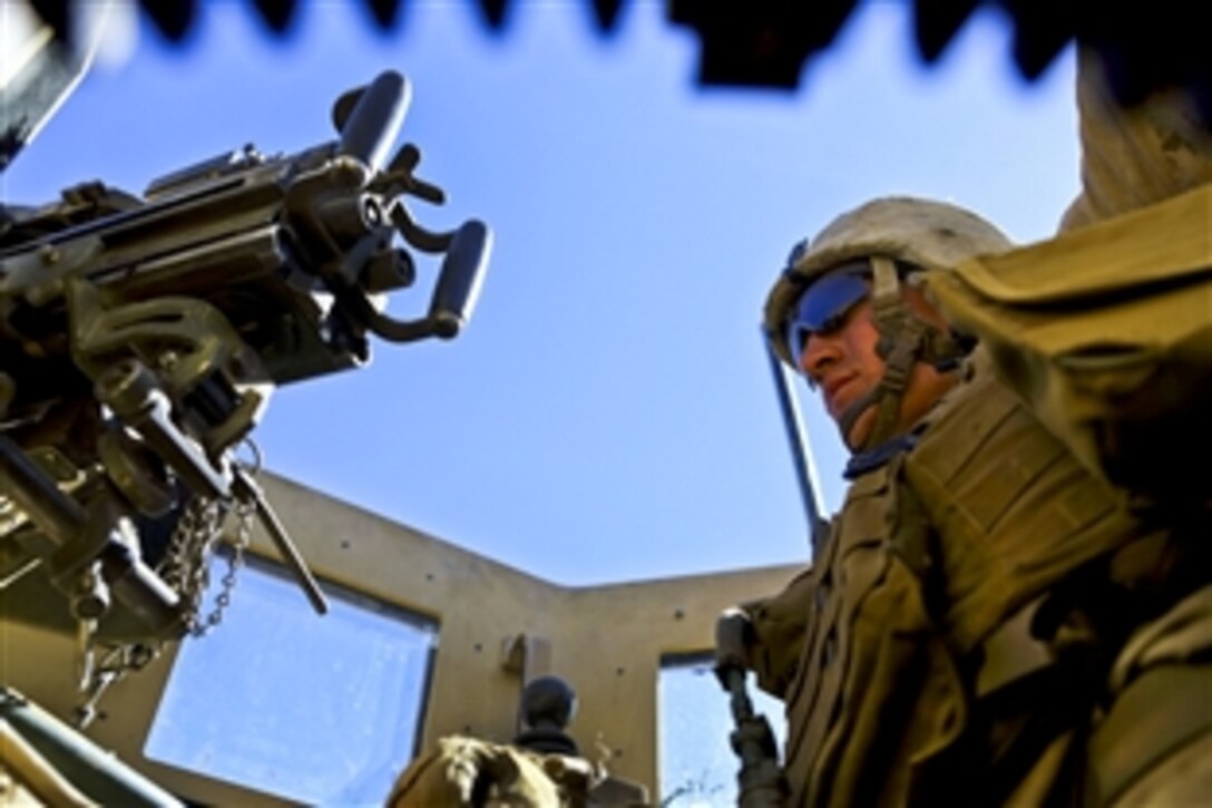 U.S. Marine Corps Lance Cpl. Michael Burchfield provides security from the turret of a mine-resistant, ambush-protected vehicle in the Now Zad district in Afghanistan's Helmand province, Feb. 17, 2014. Burchfield is a rifleman with India Co., 3rd Battalion, 7th Marine Regiment. The Marines supported Afghan forces conducting an operation in the area. 