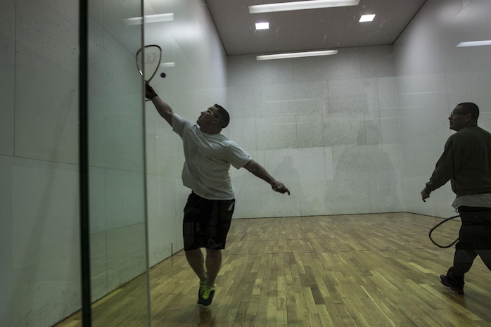 Staff Sgt. Nathan Fisk, a participant in the Commander’s Cup Racquetball Tournament, hits a racquetball during a game inside the IronWorks Gym aboard Marine Corps Air Station Iwakuni, Japan, Feb. 7, 2014. Fisk placed first in the tournament, with Master Sgt. Raul Zepeda, another participant in the competition, taking second. 