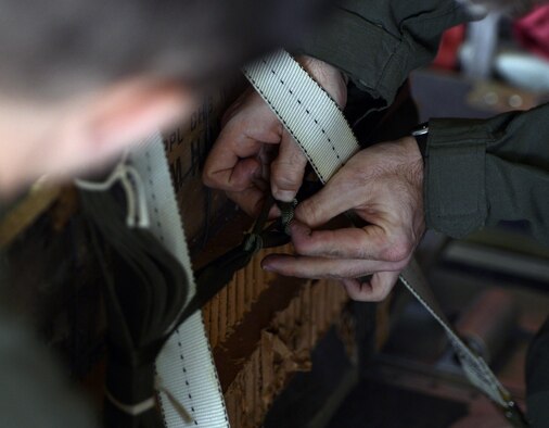 Staff Sgt. Jordan Rose secures an airdrop bundle during Stolen Cerberus, a two-week flying, training deployment designed to incorporate various training methods in order to maintain proficiency during deployed operations and increase interoperability with the Hellenic air force, Feb. 2 to 14, 2014. The training mission brought U.S. and Greek military forces together to build upon and strengthen the bonds currently shared between the two countries, while continuing to improve interoperability as Greece and the U.S. continue to work together in operations worldwide. Rose is a 37th Airlift Squadron loadmaster.(U.S. Air Force photo/Staff Sgt. Kris Levasseur)