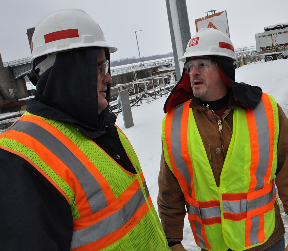 Jim Rand, U.S. Army Corps of Engineers, St. Paul District, Lock and Dam 8 lockmaster, left, and Joe Schroetter, U.S. Army Corps of Engineers, St. Paul District,project manager, discuss the winter maintenance at Lock and Dam 8, near Genoa, Wis., Jan 14.