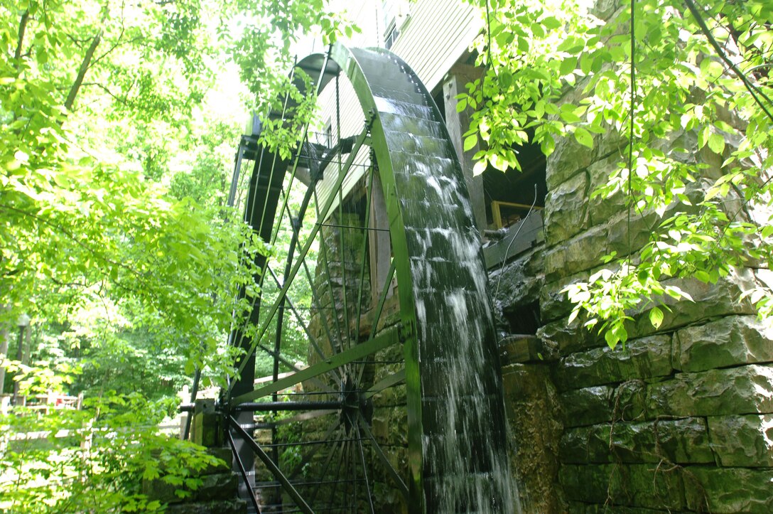 The overshot waterwheel at Mill Springs Mill turns while the mill operates during the 18th Annual Cornbread Festival May 28, 2011.  There was a large turnout of people to see the mill and enjoy the booths and entertainment by scenic Lake Cumberland.