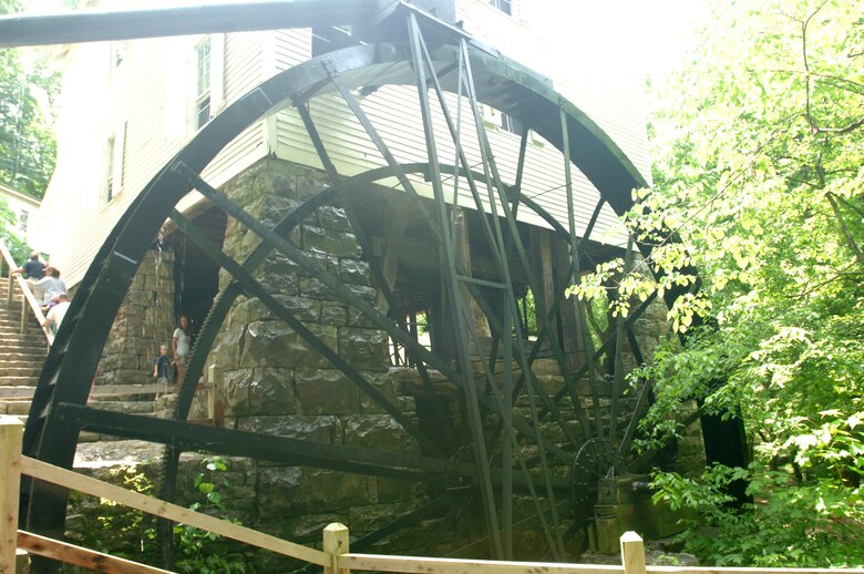 The overshot waterwheel at Mill Springs Mill turns while the mill operates during the 18th Annual Cornbread Festival May 28, 2011.  There was a large turnout of people to see the mill and enjoy the booths and entertainment by scenic Lake Cumberland.