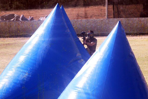 Corporal Jayme Copeland, with Combat Logistics Regiment 17, engages her opponent from behind a barrier during the Commanding General’s Cup paintball tournament aboard Camp Pendleton, Calif. Feb. 20, 2014. Four out of the five Combat Logistics Regiment 17 teams placed in the tournament.
