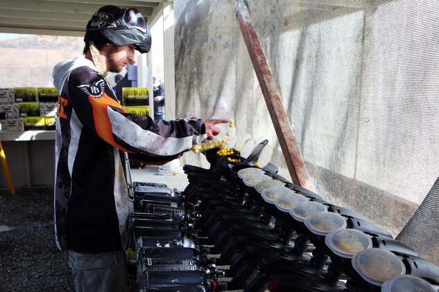 Braden Cloninger, paintball volunteer, fills paintball guns with approximately 200 rounds during the Commanding General’s Cup paintball tournament aboard Camp Pendleton, Calif., Feb. 20, 2014.