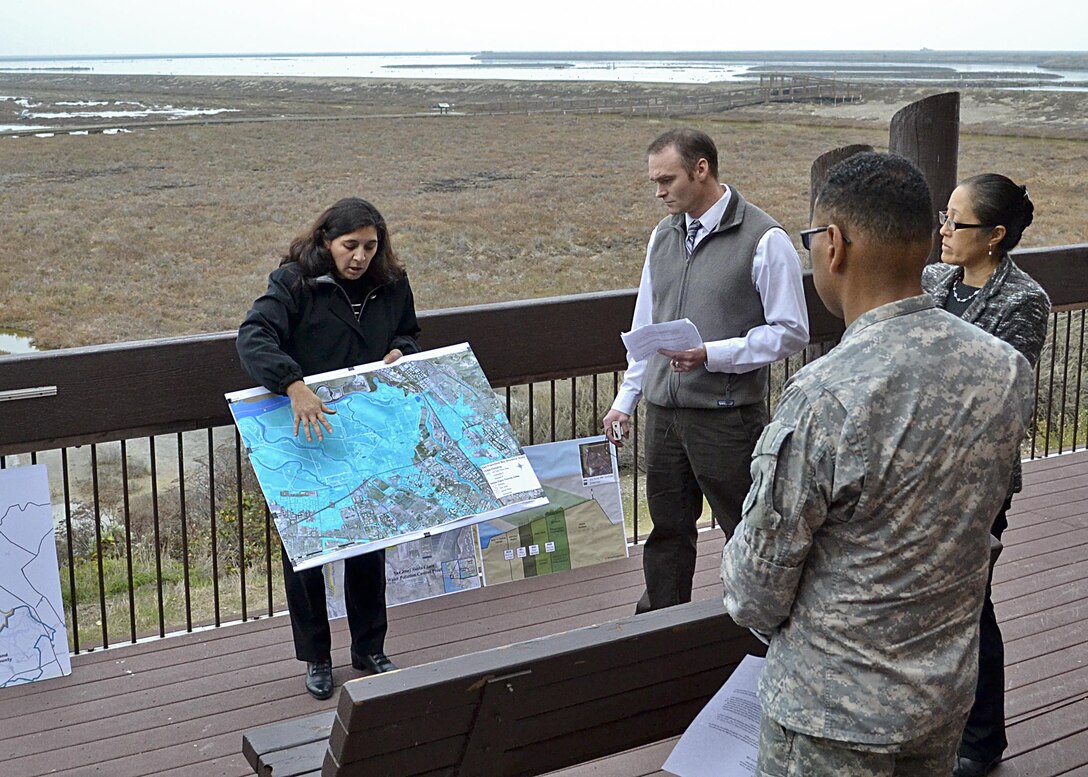 Caleb Conn, San Francisco District Project Manager, joins Santa Clara Valley Water District staff members Norma Camacho, Chief Operating Officer and Rechelle Blank, Engineering Unit Manager, to present the current Feasibility Study to Brig. Gen. Turner, South Pacific Division commander, on Feb. 12, 2014, at the U.S. Fish and Wildlife Service Education Center, Alviso, Calif. The study looks at both Ecosystem Restoration and Flood Risk Management in an area critical to the water district. Two Non-Federal Sponsors (NFS), the California Coastal Conservancy and the Santa Clara Valley Water District (SCVWD) Board of Directors, teamed with Lt. Col. John Baker, San Francisco District commander, and his District team to show Brig. Gen. Turner projects during a day-long tour that began in Santa Clara County and ended at the Port of Redwood City.