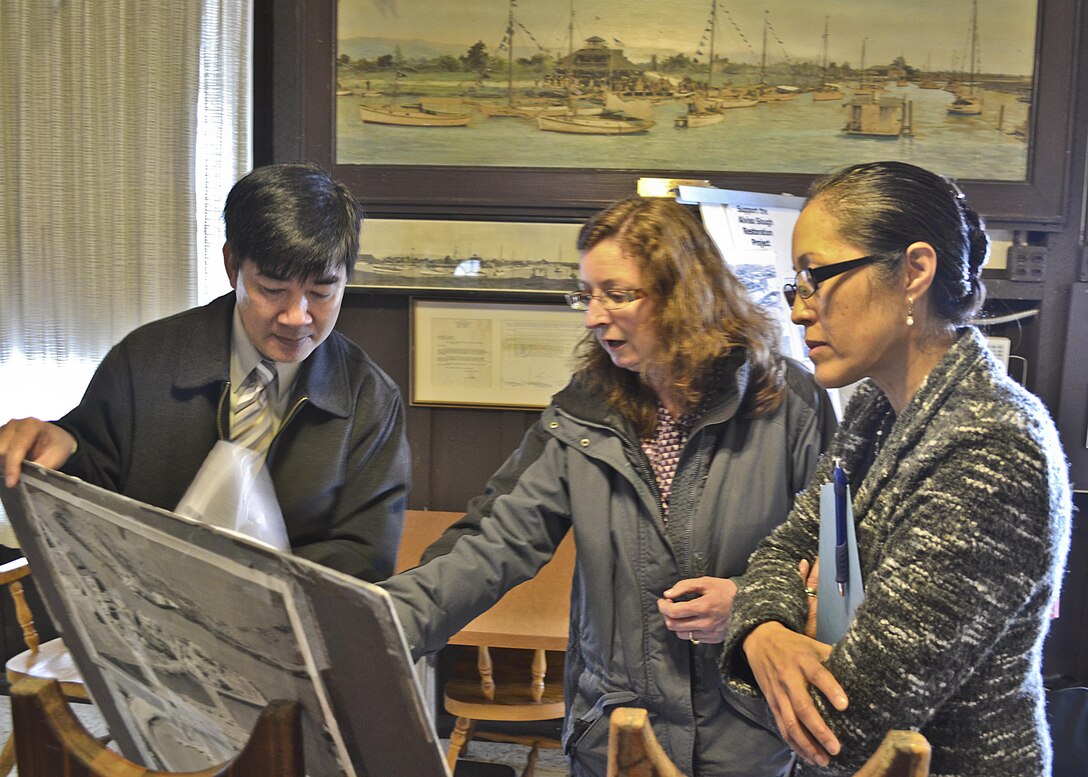 Jane Hicks, San Francisco District Regulatory Branch Chief, and Ngoc Nguyen, Santa Clara Valley Water District (SCVWD) Project Manager discuss USACE regulatory and permiting processes for a Sponsor proposed design of the restoration of Alviso Slough as Norma Camacho, SCVWD Chief Operating Officer listens at the South Bay Yacht Club on Feb. 12, 2014, Alviso, Calif. Two Non-Federal Sponsors, the California Coastal Conservancy and SCVWD, teamed with USACE, San Francisco District Program Managers to discuss partnering on flood management projects that consider both Ecosystem Restoration and Flood Risk Management in the design in an area critical to the water district.