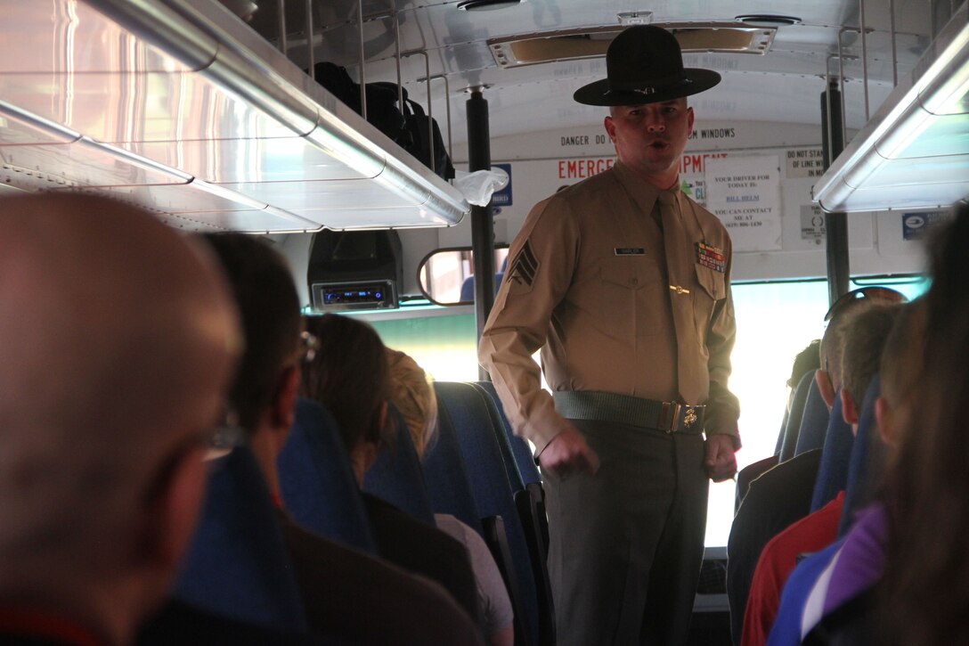 Educators from Recruiting Station Twin Cities greet a receiving drill instructor at the 2014 Educators Workshop, Feb. 10. During the workshop, educators had the opportunity to ask see what the Marine Corps is like, visit Marine Corps Recruit Depot San Diego and interact with Marines.