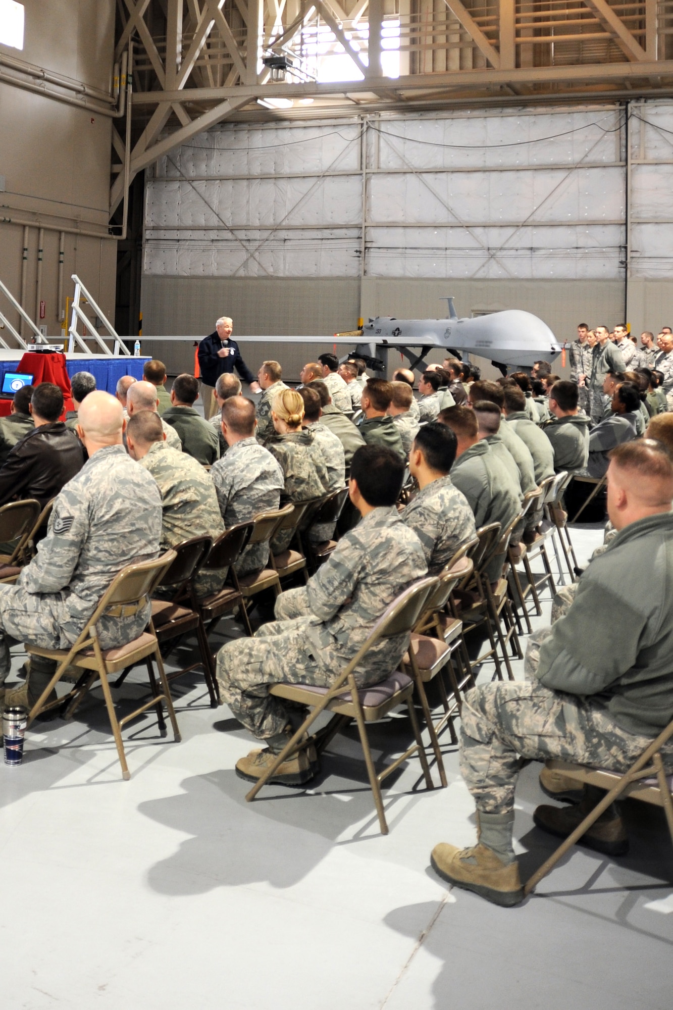 Retired Chief Master Sgt. of the Air Force Robert Gaylor speaks to 432nd Wing and 799th Air Base Group Airmen at an all call Feb. 7, 2014, during a visit to the Las Vegas area. Gaylor told stories of his personal and professional life and shared thoughts and lessons learned from his Air Force career. (U.S. Air Force photo/1st Lt S.S.)